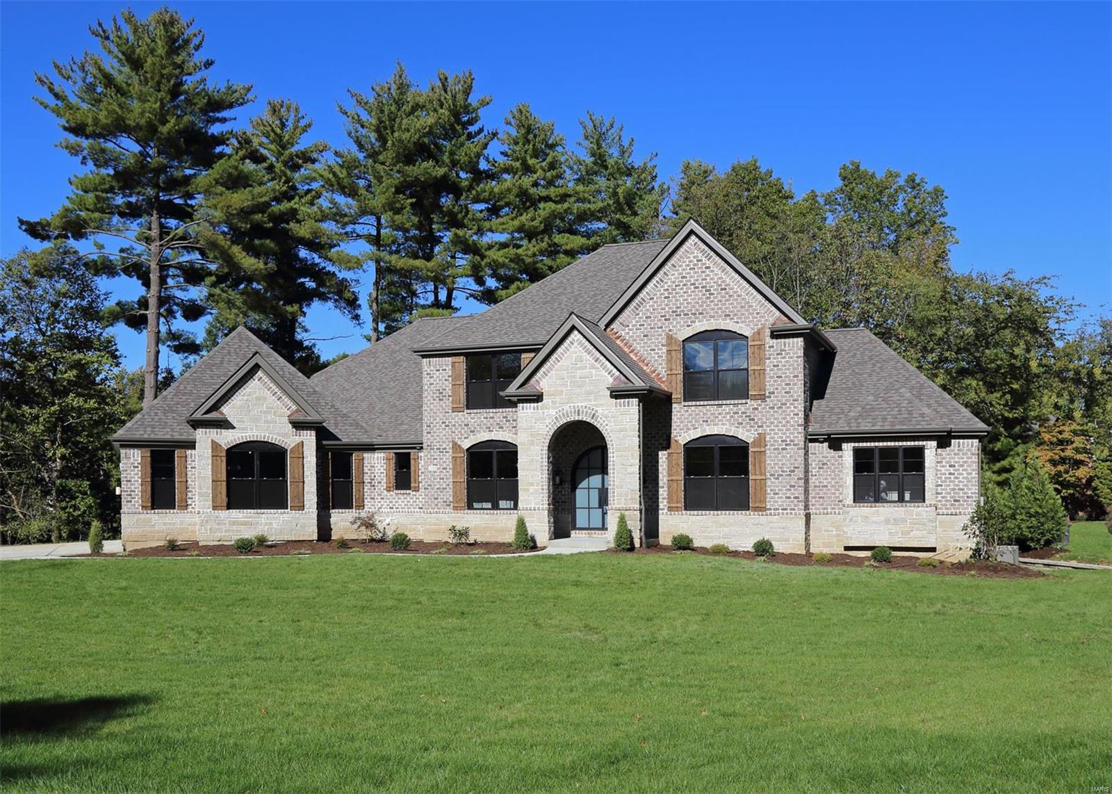 4,176 sq ft 1.5 Story by JS Clement Construction now completed. Price includes finished LL w/rec rm, bdrm, bath & bar. Over 5,300 sf living area. Beautiful cul-de-sac site on a private lane in the heart of Creve Coeur. Exceptional quality & impressive high end finishes. Brick/Stone front & sides, LP SmartSide siding, Pella windows, iron entry doors. Formal dining & 1st flr office. 2 sty great rm w/stone frplc. Extensive crown moldings, 3-1/4" window casings, 5-1/4" base moldings. Solid hardwoods & custom wood staircase. Thermador Pro applcs incl gas range, 2nd built-in oven, drawer microwave & 48" built-in fridge. Wet bar w/bev cooler. Quality cabinetry w/soft close drawers & doors, under cab lights & Quartz counter tops. Hearth rm w/fireplace exits to a covered deck/outdoor rm w/stone fireplace. 1st flr mstr suite with huge luxury bath w/custom tile & marble finishes. 3 large bdrms & huge bonus rm on 2nd flr. High eff zoned HVAC & Tankless H2O heater. Fantastic Location. Don't Delay! Additional Rooms: Mud Room COOL: 14 SEER+