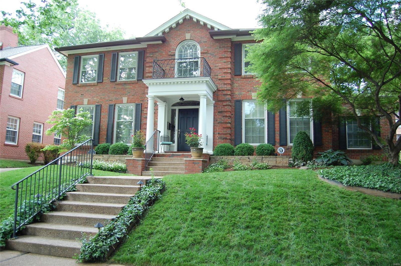 WOW! Impeccably updated, move-in ready Colonial in Moorlands. Newly-rebuilt front porch w/mahogany ceiling, custom center hall bar perfectly designed for entertaining; gorgeous wraparound entry stairs, newer kitchen w/granite counters, stone backsplash, Sub Zero, Thermador, Viking, Bosch appliances; opens to family room w/skylights overlooking private backyard/patio w/outdoor speakers. Main level also includes formal living rm w/woodburning FP, formal dining rm, original butler’s pantry, private office w/heated floor, and 1/2 bath. Upstairs, spacious master suite w/luxury bath w/walk-in closet, heated marble floors, his/her adult height vanities, soaking tub w/chandelier, frameless marble shower. Three more bedrooms and full bath complete 2nd floor. Finished lower level w/media/rec room and third full bath. Custom closets, architectural details, 2-car garage. Walk to Glenridge Elementary, Wydown Middle, restaurants and parks. Please see improvements list for numerous recent updates.