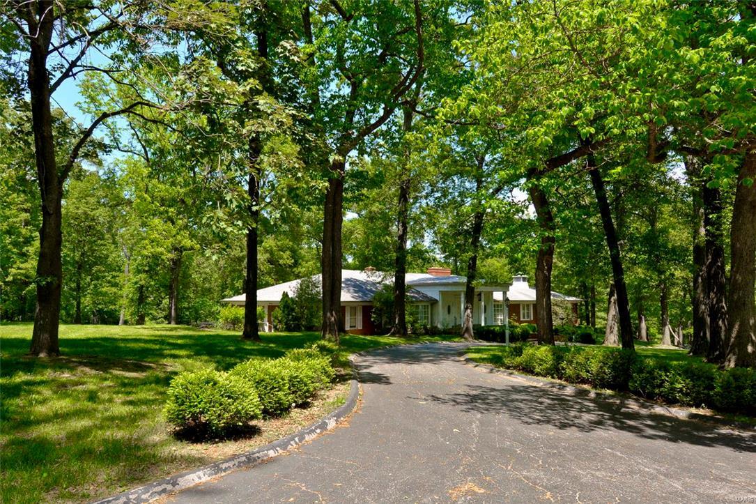 LOCATION! LOCATION! LOCATION! 3.47 Acres heart of Ladue * Prime build-able lot! Build your dream estate here!  Premiere area in Ladue off Log Cabin Lane * Rare opportunity to restore or build your own spectacular custom home on this gorgeous private 3.47 ACRES in the heart of Ladue!  Level & Gently sloping tree private acreage * Private Gated Access to Hwy 40 * 10 minutes to airport! * Live near Ladue’s horse trail * All Brick Custom Ranch * Over 4700 SqFt Ranch * 3 Bdrms 2.5 baths main w/2 full bath in LL * Mn Flr Laundry * 3 Car Rear Entry Garage * Circle Drive * Located on quiet cul-de-sac * Impressive circular entry w/domed circular clg & Terrazzo flrs *  Sunken Liv Rm w/high clgs, coved mldg, fireplc & wood flrs * Lrg Din Rm * Vaulted Great Rm w/2nd FP, wood flrs * Walks out to patio overlooking inground pool * Mstr Ste w/2 Wlk-in closets & Sitting Rm * Huge unfinished walk-out LL plus Maid’s quarters w/bdrm, famr rm & bath & 2 pool dressing rooms w/full baths *  Welcome Home!