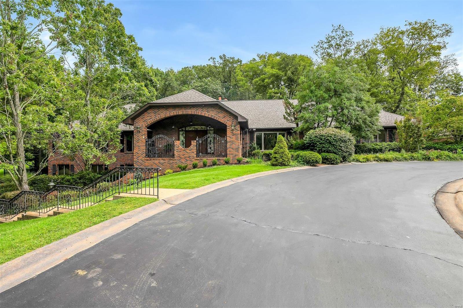 Welcome to your dream home in the prestigious Meadowbrook Country Club Estates! This exquisite ranch, situated on a desirable corner lot with two sides bordering the golf course, offers luxurious living with a seamless blend of elegance and comfort. This beautiful home boasts a generous open living area with stunning oak flooring throughout. The recently renovated kitchen features sleek granite countertops, a large center island with a JennAir electric stove top, and a Bosch dishwasher. The butler's pantry includes a breakfast bar and a dual-zoned cooler/refrigerator. Enjoy the spacious sunroom just off the kitchen, which opens up to a pristine pool and patio, ideal for summer gatherings and relaxation. The outdoor space is enhanced by a tranquil koi pond with a cascading waterfall. The fully finished basement is an entertainer's delight, complete with a second kitchen featuring double ovens and a 6-burner JennAir stove. A wood fireplace with a gas starter adds a touch of rustic charm.