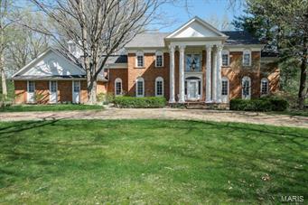 French Colonial Revival 2 story with brick circular driveway. Welcoming front entrance thru glorious flowing floor plan to spring garden at rear. Updates include; newer roof, furnaces, wood floors and generator. Widows walk & cupola are crowning features!