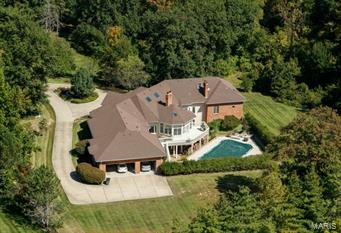 If you ever wanted to celebrate a refined Lifestyle of Luxury living in Ladue, w/prestigious size home & setting, now is the time! Rambling custom ranch, over 10,000 total SF*. Splendid pool w/gracious grounds. Ideally situated off Log Cabin Lane; zoned "Equestrian" for the enthusiast. Surrounded by Multimillion dollar homes; 3 rolling acres on an exceptional private street. Aggressively reduced over $550,000 to provide buyers room they need to create changes in cosmetics & decor. 6BD/6BA w/a fully finished walk-out, above-grade Lower Level. Soaring ceiling heights and an open floor plan make this an easy-to-live-with layout. Glassed Sunroom & deck. Job-finished wood floors. Main level Master w/sitting room & FP. 3 add'l main level BRs. 2 BRs on LL, above grade. Eat-in kitchen enjoys pantry, island & large bkfst room. Lower Level is 3000+ SF. Circle drive. 3-car garage. At this strong a reduction, property sold as-is, seller to do no repairs. (*6900 SF Main, 3100 SF LL) Additional Rooms: Sun Room