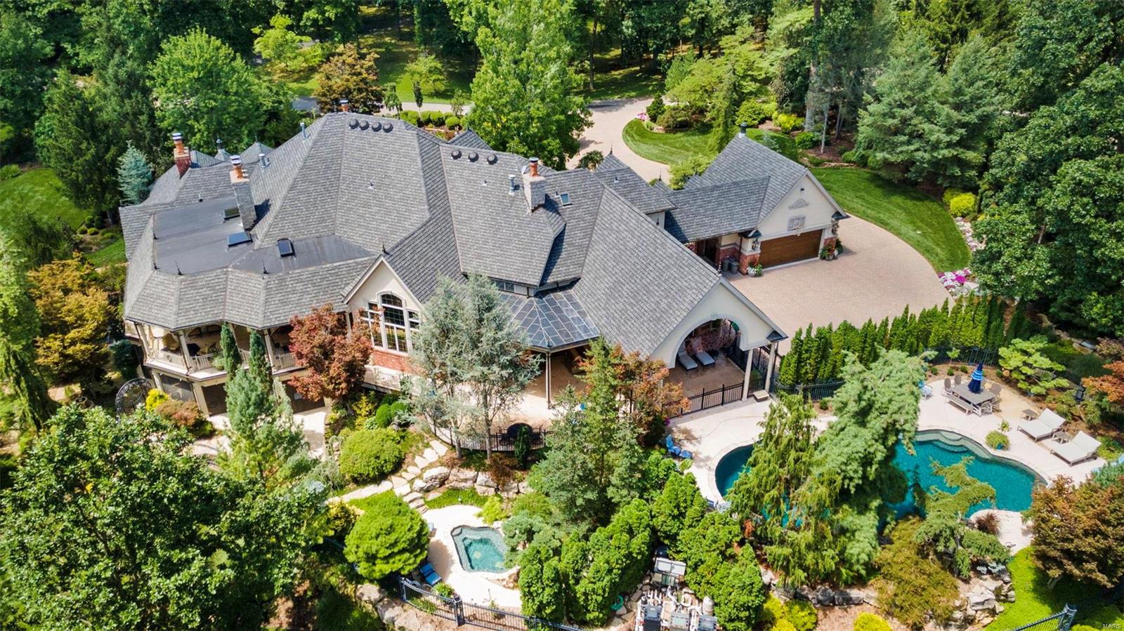 The pinnacle of luxurious living w/nearly 13,000 sq ft of living space, this captivating home is in harmony w/the botanical gardens & outdoor spaces that have masterfully created a resort like setting over 3 impeccably manicured acres in one of the most prestigious STL locations. Your heart skips a bit as you open the door and your eyes dance over the formal living & dining room, but you catch your breath as you have a keen sense of “home” in the welcoming living room & kitchen. Everyone wins when it comes to the 7 uniquely designed bedrooms as each includes their own private bath, w/the main level primary suite taking center stage. Finished walkout LL is sure to delight the entire family w/wine cellar, game room, theater, home gym, 2nd kitchen & sauna; and outdoor enthusiasts will relish the spectacular main level lanai w/soaring plank ceiling, vast LL screened terrace, free form pool, wading pool, and spa. This extraordinary home is one of a kind! See feature sheet. Additional Rooms: Wine Cellar