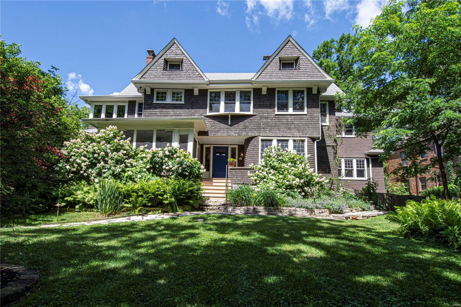 Est. 1905. Sitting on a lushly landscaped acre atop a hill in Webster Park, the wraparound porch of this Arts & Crafts beauty reminds you of what makes Webster Groves the “jewel of the suburbs”.  35 Glen has been lovingly and carefully restored for today’s style while keeping the integrity of its turn of the century design. Greeted by the grand staircase & the pristine woodwork in the living and dining rooms-the timeless beauty of the home sets the stage. The jaw-dropping kitchen renovation honors the home’s age while providing entertaining space & unsurpassed functionality-all with high end finishes & appliances.  Upstairs find 4 bedrooms including an amazing master bath retreat and the closet of your dreams. The finished third floor offers extra living space and a 5th bedroom.  While serene and secluded, you're just steps away from the cafes & shops of downtown Webster.  Main floor laundry, 2 car garage, gorgeous perennial gardens, screened porch...make your appointment soon! Additional Rooms: Mud Room