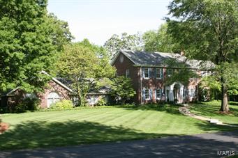 On a private park like setting in Ladue, discover this gracious home perfect for entertaining and raising a family.  Exuding the wonderful character you would expect, this four bedroom, four and a half bath home features elegant living and dining spaces, an exquisite master suite, and professionally finished lower level with kitchenette and even a Murphy bed.   Classic architectural features include arched library windows, custom built-ins, hardwood floors, gas fireplace, substantial crown moldings, and solid wood six panel doors.  Go directly from the oversized four car garage to a mudroom with built-in cubbies, and enter the center island kitchen and bright family room.  Spill out to the delightful flagstone patio and enjoy professionally landscaped grounds on an oversized lot with a low maintenance in-ground pool.  Don’t miss this opportunity to live in one of St. Louis’s finest neighborhoods! Additional Rooms: Mud Room