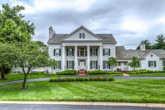 A truly magnificent 1.5 Sty Southern Colonial on 2.3 acs!  Expansive windows provide unsurpassed views while hardwood & marble flooring, elaborate millwork & plantation shutters add to the home’s graceful ambiance. 2-sty marble foyer leads to formal living room with marble fireplace & built-in bookcases, elegant dining room, library-paneled family room with brick fireplace & vaulted sunroom with wet bar. State-of-the-art kitchen with cherry cabinetry, granite countertops, Viking appliances, center island & butler’s pantry adjoins breakfast room & inviting 4-seasons room. Coffered master bedroom suite features den with fireplace & lavish bath. The 2nd floor extends the living quarters with 4 additional bedrooms, 2 with private baths & 2 with Jack n’ Jill bath.  Incredible Lower Level with recreation room with wet bar, game room, exercise room, wine cellar & bath. Grounds include lanai, pool, covered patio with stone fireplace & pool house with 5-car garage plus heated 3-car garage. Additional Rooms: Sun Room