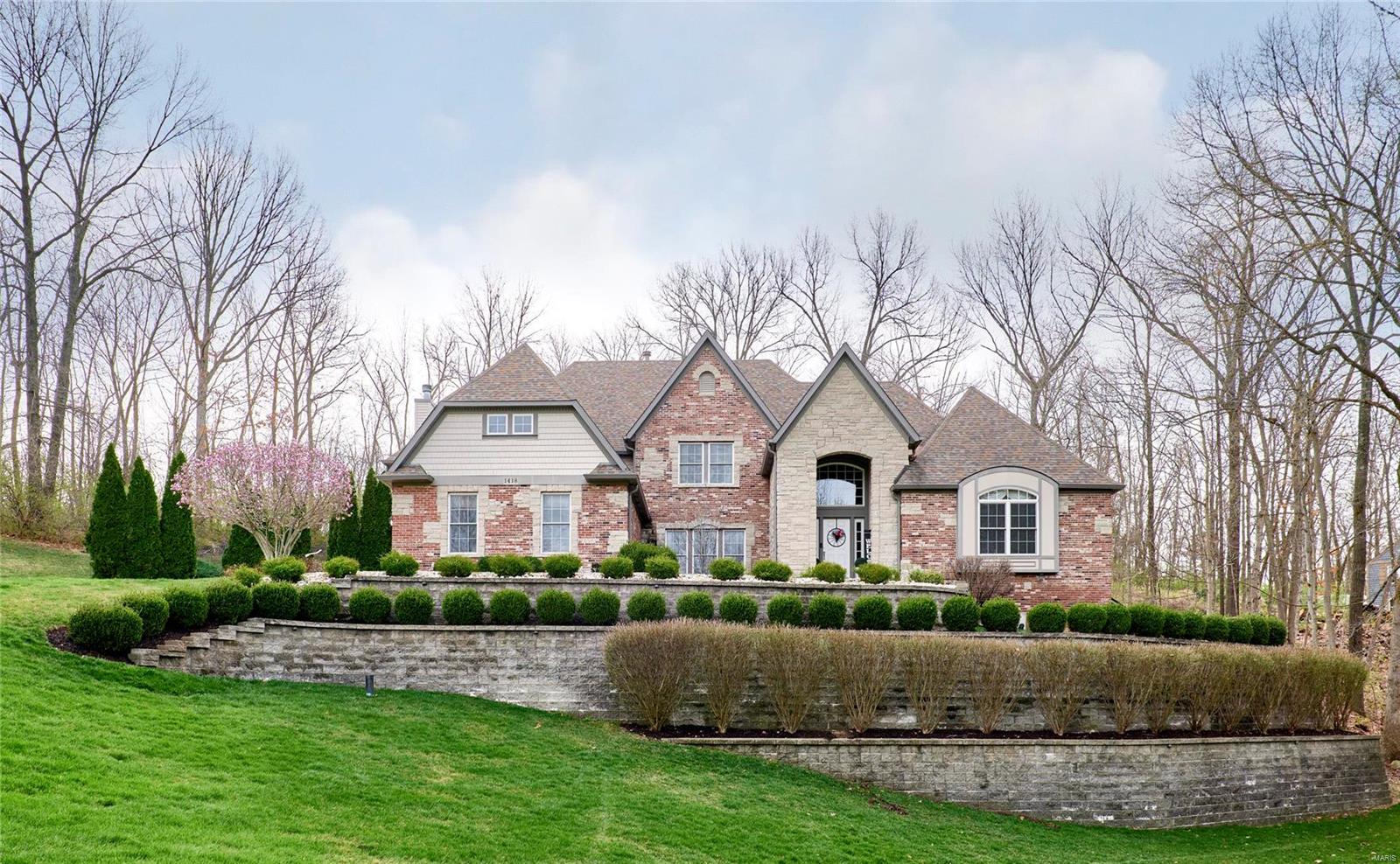 Gorgeous brick & stone 5-bedroom, 5 total bathrooms, 1.5 story on private 1.6 acre lot with over approximately 6,400 finished square feet of living area! Beautiful Baker gunite pool. Grand 2 story entry & great room with floor to ceiling windows, fireplace, bookshelves. Private office. Separate dining room. Kitchen featuring newer custom island, all Viking appliances: built in refrigerator, double French door oven, gas cooktop, built in microwave, wine cooler & dishwasher.  Butler’s pantry. Breakfast room. Hearth room with stone fireplace. Main floor master suite with 2 walk in closets, huge bathroom, free standing top & walk in shower. Incredible lower level featuring: Bedroom, Full Bathroom, Theater room with 102” screen, high end equipment, 8 powered theater seats. Game area. Family room. Potential 6th bedroom. Built in storage in basement. Hardwood floors. Custom moldings. Andersen windows. 3 car garage with Garage Tek organizer. 2-AC units-2023, 2-water heaters-2022. And More!