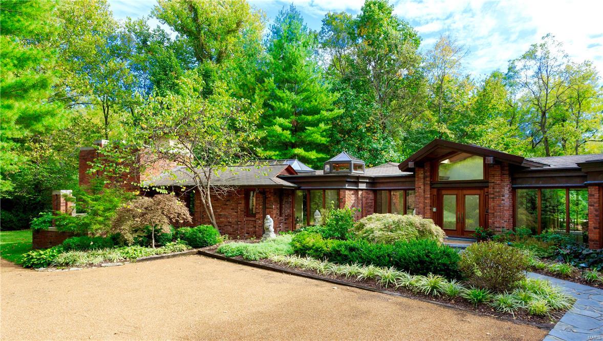 A quiet sense of recognition occurs when you come upon a special place. Such is 215 South Warson Road. Rarely, does a property become available that appeals on every level. This home, with its sophisticated aesthetic, could easily be featured in Architectural Digest, yet offers an opportunity for the investor who recognizes quality and value. Turning onto the private drive, you are summoned by this retreat as a feeling of serenity envelopes you. Entering the home you become immediately aware of the uncompromising quality of construction. The rear of the property with pool, spa and gardens offers a retreat that few will ever be fortunate enough to enjoy. Sited on 1.2 beautifully landscaped acres, it could not be replicated for anywhere near the asking price. The owner has nurtured her retreat. Now retired, she looks forward to the next chapter in her life and offers this extraordinary opportunity to the next keeper of this kingdom. Surrender, and come home to your Sanctuary in Ladue.