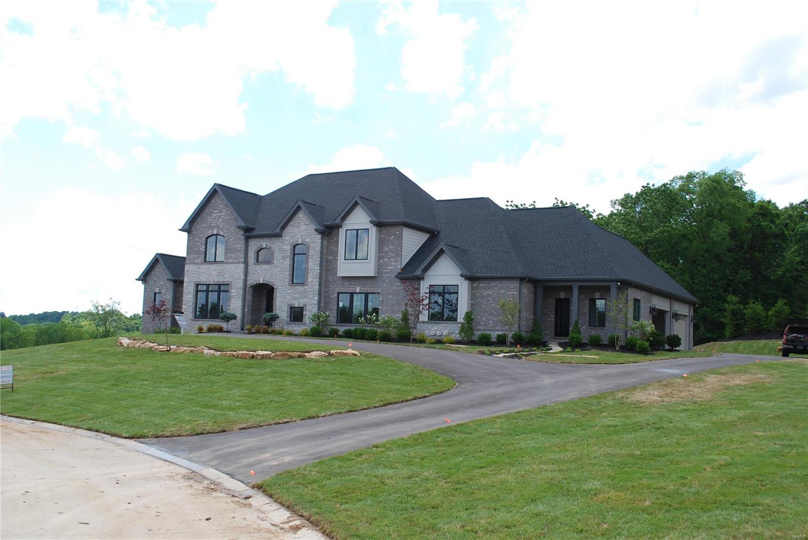 NEW CONSTRUCTION COMPLETED & READY FOR IMMEDIATE CLOSING! Exquisitely built & designed 1.5 story 5 bedroom, 6 bathroom estate on 2 acres within a new Rehnquist Design & Build, Inc. 7 lot subdivision. Situated on a premium lot with level rear yard w/potential future pool area at main floor level and covered veranda. With approx 6,300 sq ft living space, large main floor master suite featuring “his and her” walk in closets, spacious finely detailed master bath. Main floor guest suite. Open floor plan allows kitchen, breakfast and gathering rooms to flow together. High level of finish with multi-piece crown molding, beams and cased openings and doors with high end cabinetry. Second floor consists of 3 full en-suites, bonus room,2nd floor laundry room. Side entry 4-car garage. To include finished lower level to painted drywall. Side walk out. Sod to be installed w/in 3 weeks.  GPS 1919 S Mason Rd. Town & Country 63131. OPEN HOUSE SUNDAY 5/17/20 10-12 PM.