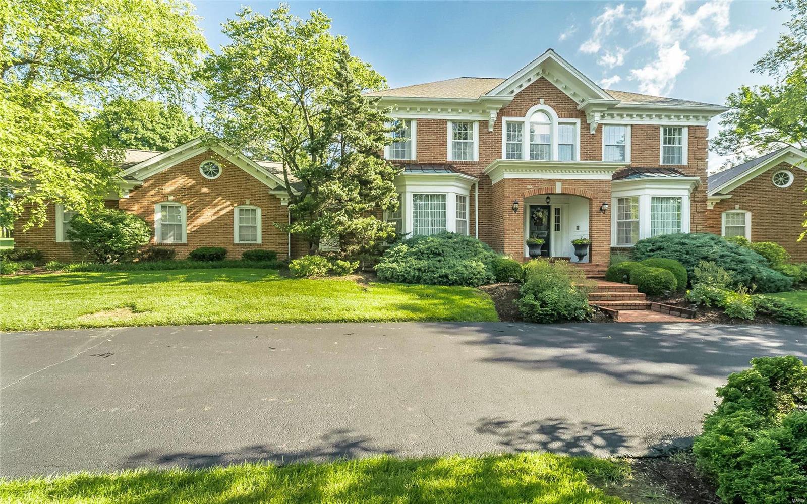 Welcome to this beautifully designed 1.5 story brick home situated on a level 1.38 acres perfect for adding a pool! With almost 5000 square feet, this custom Higginbotham home features a main entry foyer and staircase, formal living and dining rooms, a family room that has a full window view of the backyard, gorgeous built-in book cases, fireplace and wet bar. There is also a separate sunroom that offers a panoramic view as well; large over-sized kitchen with Center Island, breakfast room, large laundry room with a ½ bath. There is a beautiful all wood paneled Den with see-through fireplace. The Master bedroom suite has a full master bath and two separate walk-in closets. There are 4 bedrooms upstairs with 2 Jack and Jill bathrooms. The lower level has a large recreation/family room with fireplace, large master bedroom suite with walk-in closet and walkout door. This home is waiting for someone to put his or her own personal touch to and make it into a fabulous Town & Country retreat! Additional Rooms: Sun Room