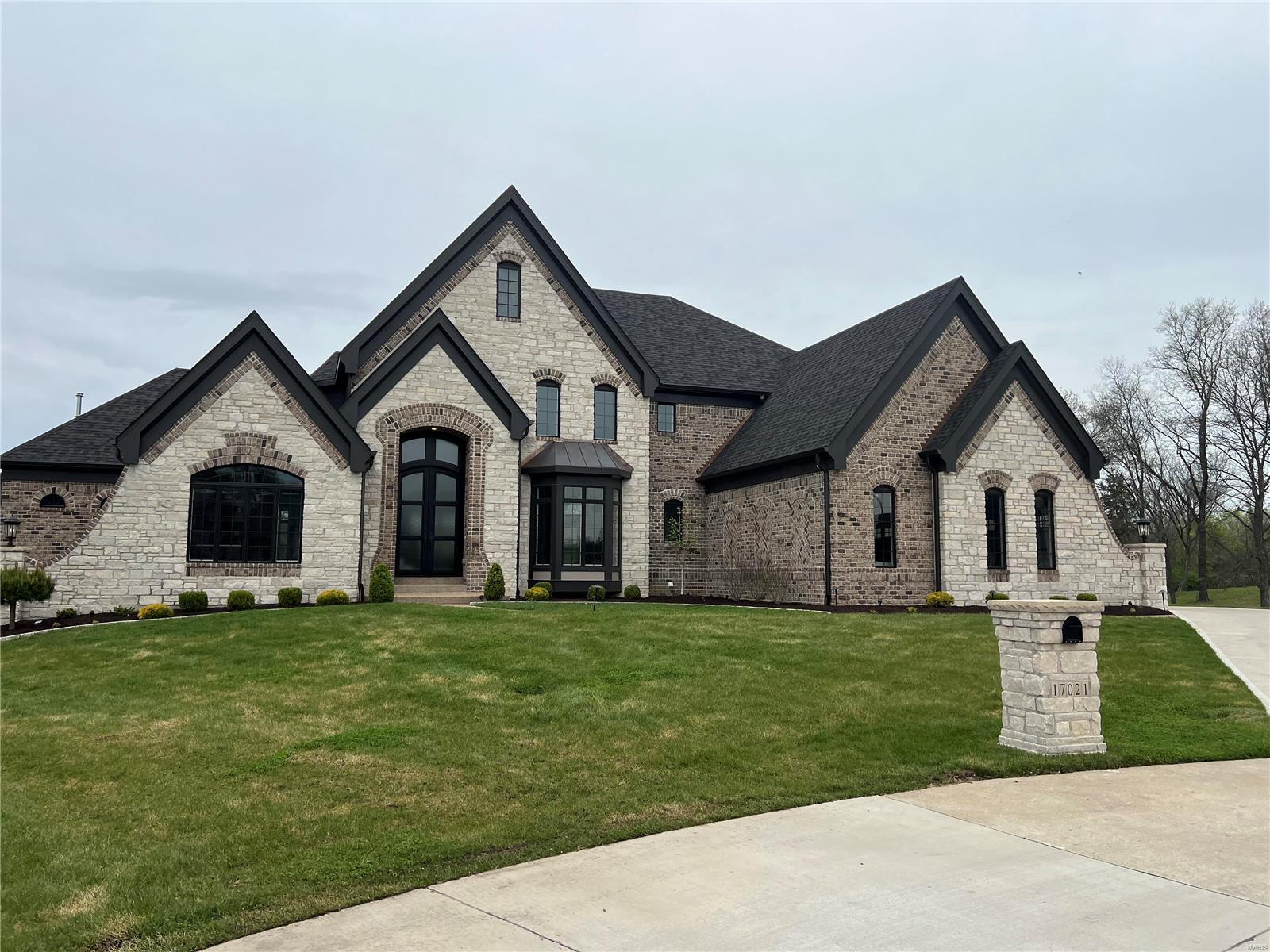 Luxe living in Lafayette Crossing! This stunning 1.5-story, two year old custom build offers 5 beds, 6 full/2 half baths and approx. 7,300  sq. ft. of finished living to enjoy. Expanded floor plan, open concept living with foyer, flanked by dining and study, flow into the great room with see through FP to the two story hearth room, light filled breakfast and gourmet kitchen with expansive center island, high end SS appls and custom cabinetry. 10’ MF ceilings, custom millwork, and upscale finishes throughout. Main floor primary suite with bay window and coffered ceiling includes luxury ensuite bath and spacious WI closet. Upstairs find 4 bedrooms, all with ensuite baths. Walk out lower level is an entertainer’s dream: 10’ pour, wet bar, media room, rec room with fireplace & fitness room. Phenomenal, private 3 acre culdesac lot with breathtaking saltwater pool. 4 car garage. Niche, gated community in a highly sought after area with easy access to amenities, highways and schools!
