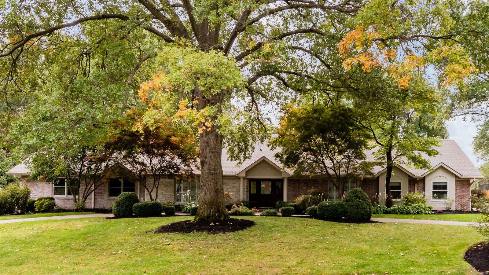 Sophisticated style is what you feel as you immerse yourself in every cultivated space of this 5 bed/5 bath ranch home in Ladue Schools. The sizable chef’s kitchen is made for entertaining, with prep areas, oversized island, custom cabinetry, copper sinks, dual subzero refrigerator/freezer, pro series Wolf Range, serving area with ice maker, wine fridge, and planning area. Master Bedroom Suite with large sitting room, and serene master bath with jetted tub and large shower for relaxing after a long day. Custom millwork, pass through gas fireplace, generous bedrooms, & cozy window seats are warm touches. The entertaining continues in the finished walk-out LL, w/ full wet bar, workout room, full-bath, craft area, and more. The three-season room overlooks the stunning 1+ acre property, with large pool and relaxing places to sit under the large trees and watch the sunset over the neighboring lake.