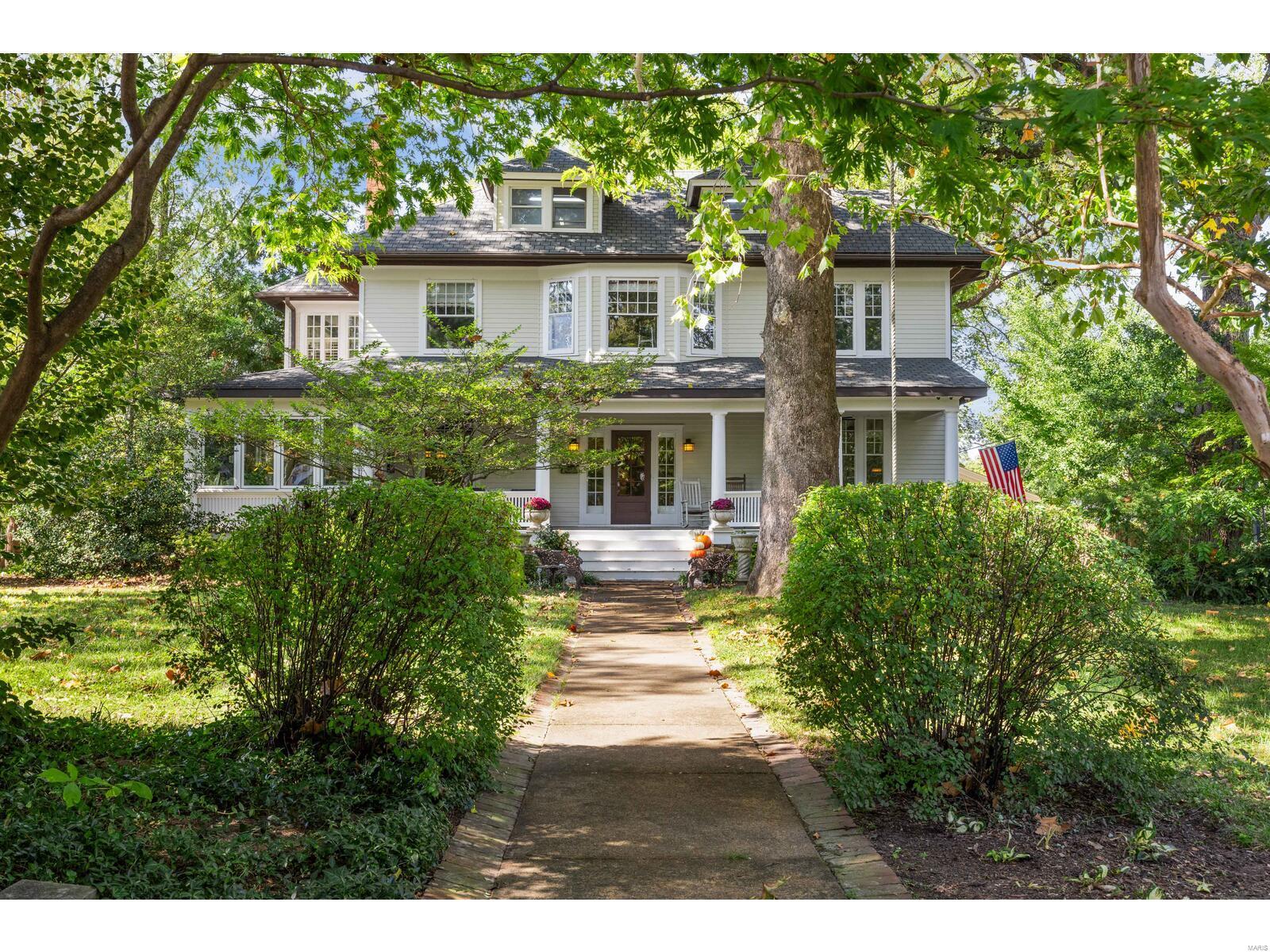 Nestled in the heart of Webster Groves, 301 Bompart is a true Webster Park gem, framed by magnificent trees and boasting a sprawling covered porch that welcomes you home. This stunning residence has been flawlessly updated to incorporate today’s desired features while preserving its historic integrity and showcasing exquisite craftsmanship from a bygone era. Inviting front foyer with its impressive, ornate wooden staircase. The gorgeous craftsman kitchen features custom cabinetry, butler's pantry, and top-of-the-line appliances: TWO integrated Sub Zero refrigerators and TWO Viking ovens! Upstairs you will find 4 bedrooms and updated bathrooms. 3rd floor features a huge multipurpose room. Additional highlights include mudroom, office, 2nd floor laundry, pub room, heated flooring, partially finished basement, composite decking. Houses like this are certainly a rare opportunity! Additional Rooms: Mud Room, Sun Room