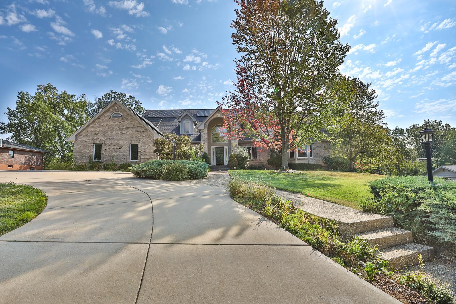 Fantastic 1.5 story, atrium, 5 bedroom, 5 bathroom executive home conveniently located with over 5,000 square feet of living space. This beautiful home offers a custom kitchen with loads on cabinets, a breakfast bar and eating area. The main floor master bedroom features a stunning luxury bathroom. The open floor plan is sure to impress with soaring ceilings and natural light. All bedrooms are well appointed with ample space for everyone. The lower level offers a massive rec. room as well as kitchenette and extra rooms. Additional features include a main floor office, 3 car side entry garage, a large 4 season room, covered gazebo and incredible yard. The offers a solar panel system as well. Additional Rooms: Mud Room