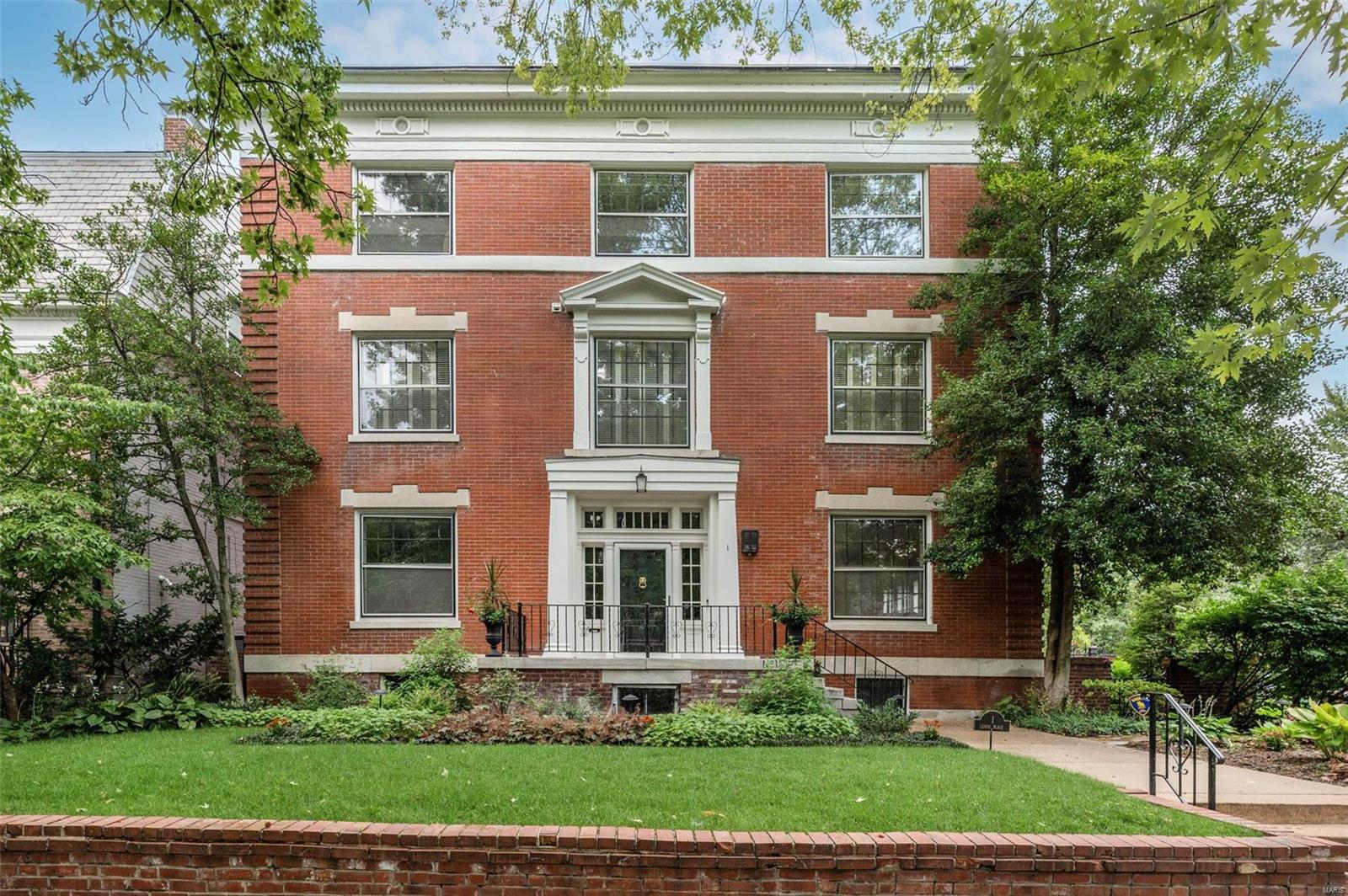 Handsome Colonial Revival home, beautifully-situated on one of St. Louis' most architecturally-cohesive private places. This full 3-story home features a lovely portico entry with sidelights and transom; stately living room with French doors overlooking a charming side garden; modern open kitchen with s/s appliances, down-draft gas range, and granite tops; plus an adjoining light-filled family room with 3 sides of windows and vaulted ceiling. The rear yard is beautifully landscaped, with a traditional brick patio and an ideal 3-car garage. The home has been tastefully updated with painting throughout, zoned A/C, new roofs in 2017 and 2020, completely new irrigation system, & updated electrical and plumbing. Fine architectural details include handsome, Regency-style detailing, gorgeous wood floors, high ceilings, and beautiful mantels. With 13 rooms and over 5,000 square feet, this home has plenty of options for at-home learning spaces and home offices for everyone in the household.