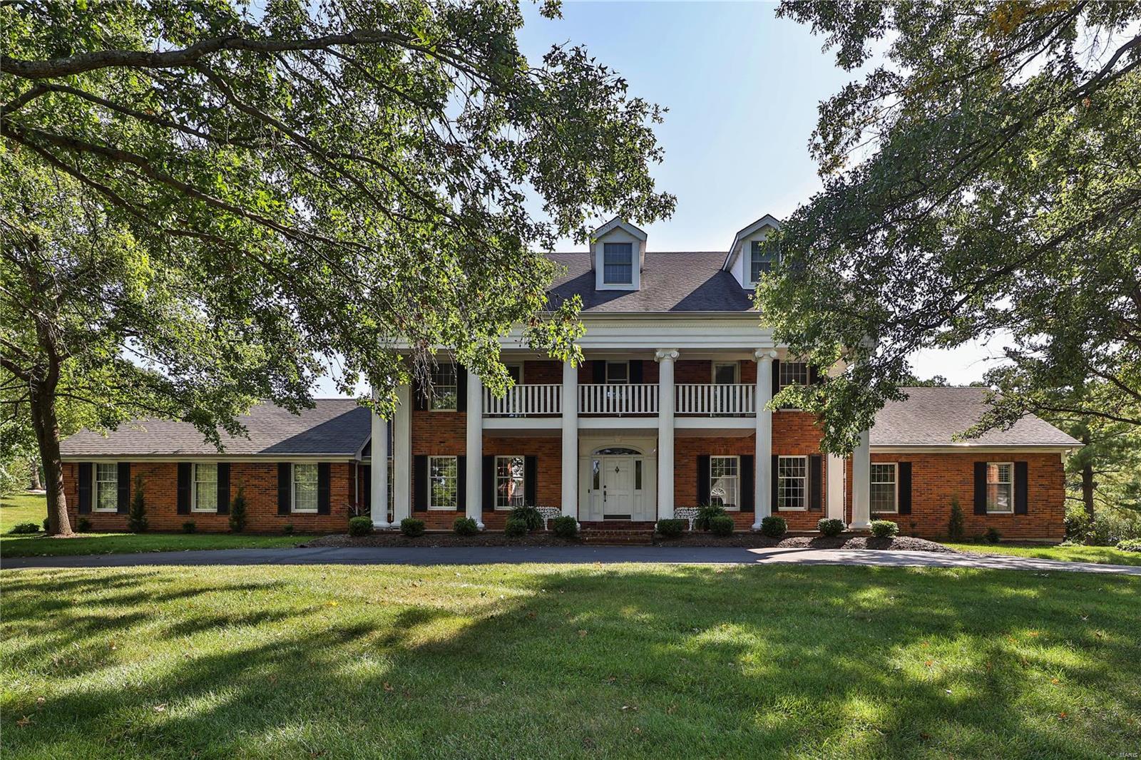METICULOUSLY MAINTAINED! FAMILY FRIENDLY! TOP DRAWER UPGRADES! Custom-built home by current owners, is PERFECT for ENTERTAINING INSIDE & OUT. A Spacious & Open Floor Plan flows from room-to-room w/French Doors leading to a Generous Brick Patio, Attractive Pool & Peaceful Setting. A remodeled Kitchen w/large working island, top appliances & back stairway, enters off a back door entry Mud Room w/half bath & Laundry Room. Breakfast Area, open to kitchen, has been opened to the Great Room...all w/French Doors &/or Windows overlooking a Beautifully Landscaped Acre. Great Room is a step off the Living Room, has a wet bar servicing both rooms & leads to a handsomely paneled Den/Study. Step to a spacious 1st Floor Master Suite w/updated Bath. 2nd floor has 4 large bedrms & 2 Jack-N-Jill baths. W/approximately 1000 sqft. of well-designed finished space, the LL says, "COME GATHER HERE!" Enjoy Wood Floors, Lovely Millwork, Circle Drive & 3 car garage. MR. METICULOUS has this home "MOVE IN READY!" Additional Rooms: Mud Room