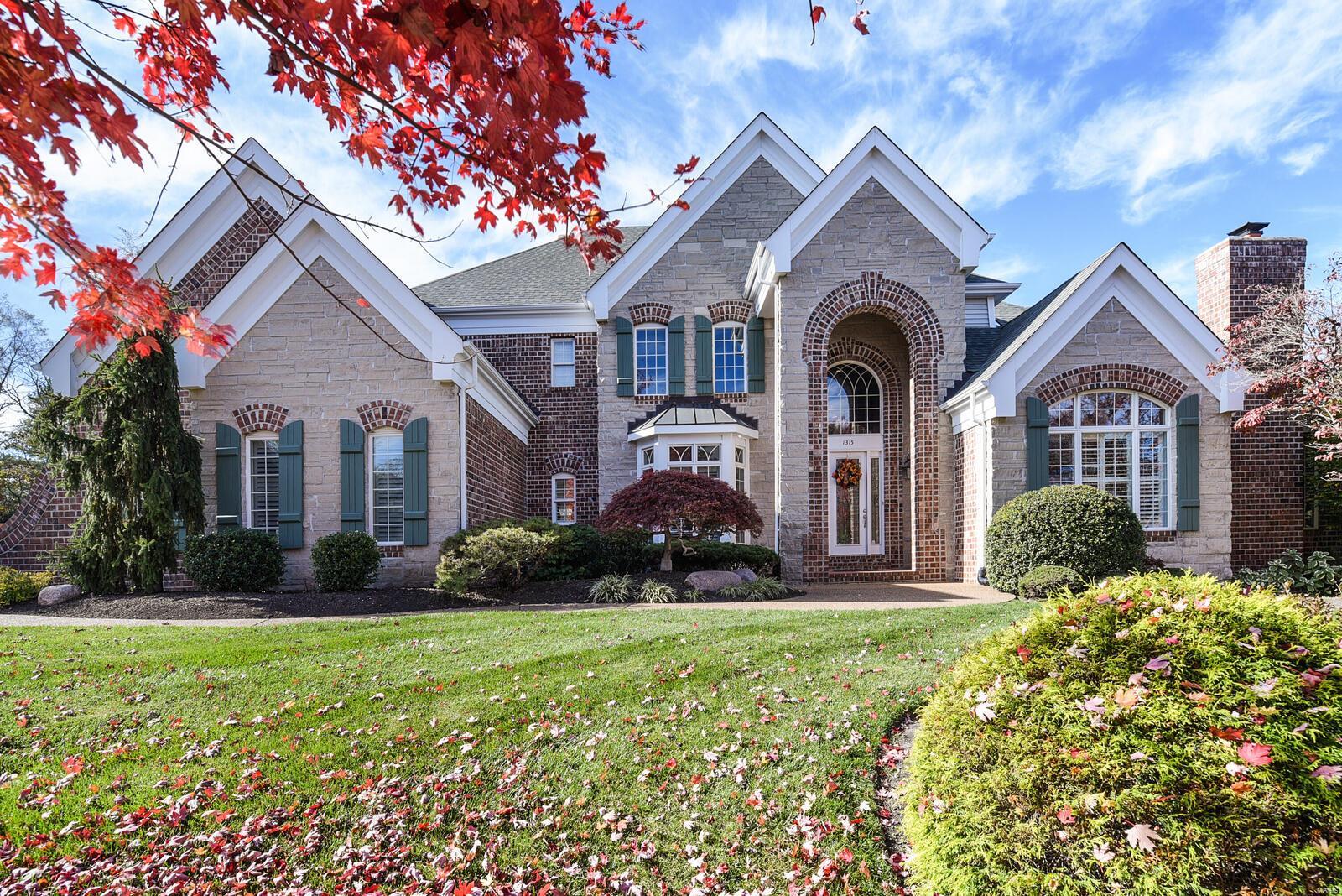 Extraordinary brick and stone crafted 1 1/2 story home situated on a private enclave of homes on a cul-de-sac street. Exceptional design and craftsmanship amplify the dramatic entryway with a curved staircase and balcony. A stunning two-story wall of windows overlooks a gorgeous Baker Pebble Tec in-ground pool on a wooded private lot. Main floor Master suite including sitting room W/fireplace and luxury master bath. Front and rear staircase have access to the second floor with three additional bedroom en-suites w private baths. Gourmet kitchen with professional-grade appliances opens to cozy hearth room. Incredible finished walkout lower level boasts a family room w/fireplace, bar area, theater room, additional bedroom, game room, studio and exercise room. The backyard is an oasis perfect for entertaining! Additional features include elaborate moldings plantation shutters, four gas log fireplaces, oversize three-car garage, This is the perfect family home built for entertaining !!