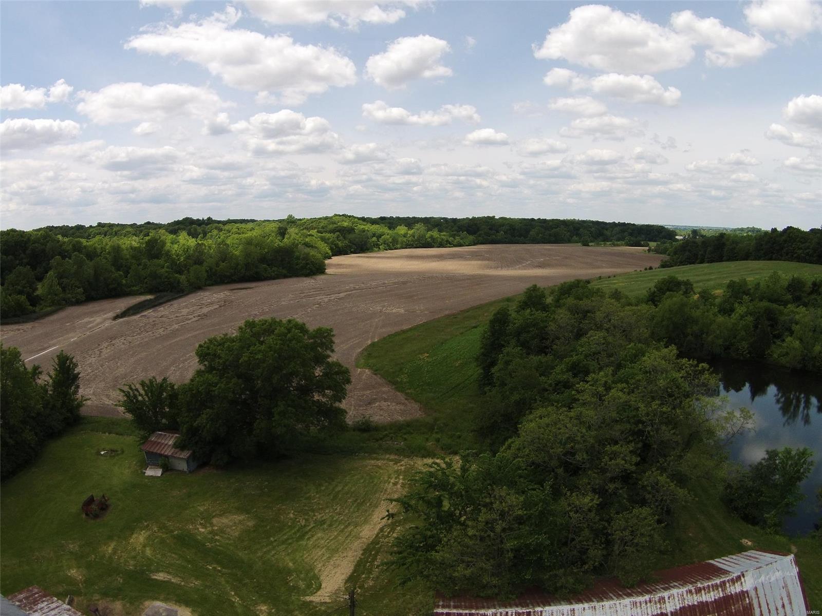 303 Gall Rd is a 70-acre parcel providing prime development opportunity in the heart of the City of Columbia. This beautiful property consists of gently rolling hills and two natural waterways. The lake and creek provided waterfront development opportunities. The property is currently income producing through a crop lease. Located just 1 mile off Rt. 3, 5 miles off Interstate 64, and 20 minutes from Downtown St. Louis, the property provides regional access for residents. Being located in the City of Columbia provides an excellent opportunity to take advantage of growth trends. As of the 2020 census, the population of Columbia is 10,999, experiencing double-digit growth rates for the last four decades. The median household income is $67,000 and the median family income is $90,000. As of July 2022, Median prices are: Home - $204,500; Square Foot - $229. Location: Rural