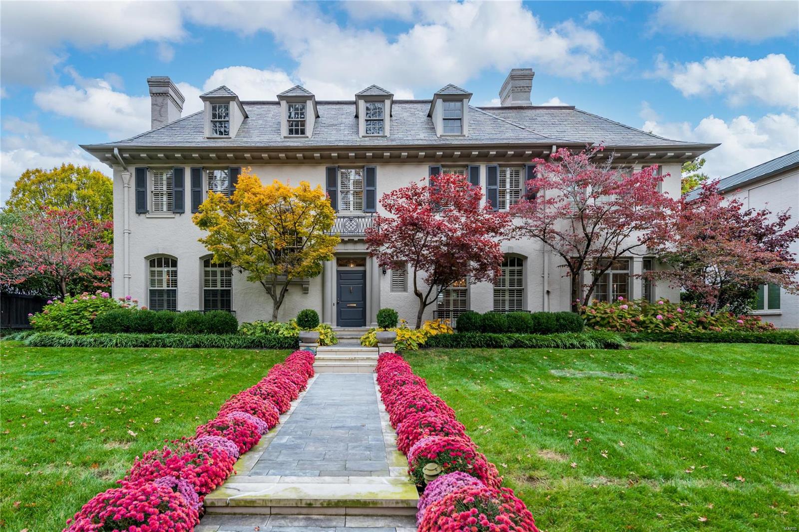 Welcome to this stylish Clayton home built in 1913 & located on one of St. Louis’ favorite streets. The home has undergone a complete transformation while respecting its historic architecture. A large foyer welcomes you inside & opens to a spacious living room that overlooks the backyard. The formal dining room features a gas fireplace with marble surround. A sunroom stretches across the east side of the home and features floor-to-ceiling windows, imported marble tile & an original fountain. A dream kitchen with large center island, gas stove, walk-in pantry & adjoining breakfast room. The bright primary bedroom features dual walk-in closets and a spa-like bathroom with steam shower, marble-topped vanities, soaking tub & heated floors. Stunning new saltwater pool surrounded by lush, manicured gardens. Hot tub, outdoor fireplace, and a master grill with custom copper hood complete the backyard. Carriage house with apartment/office and a full bath. Lower level with wine room and storage. Additional Rooms: Wine Cellar