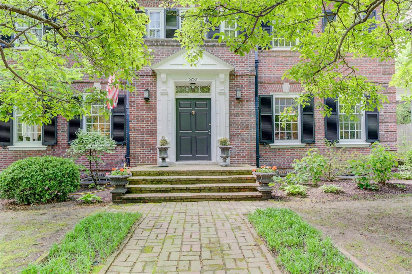 This is your opportunity to own a classic piece of St. Louis historic architectural history. If you are looking for a spacious, formal, & elegant home, you have found it. The home feature a modern updated kitchen, newer appliances, center island with cook top, some original wooden pantries, wood floors, & cozy built in bench. As you enter you are introduced to a two story  large entry hall, front & rear staircasses, a sitting/plant room, 3 1/2 baths, laundry room off the kitchen. You will enjoy living in a prestigious quiet neighborhood off Skinker, this may be the home for you. Now add a patio, in-ground pool, close to a 1/2 an acre of yare to enjoy outdoor activities and a 3 car garage with extra parking. The living room has a statly wood burning fireplace. All of this and within walking distance of Wash U, public transportation, & Forest Park. The home also has a covered portico off of the side dining room entrance. Newer slate roof & furnace. This beautiful home has plenty to offer