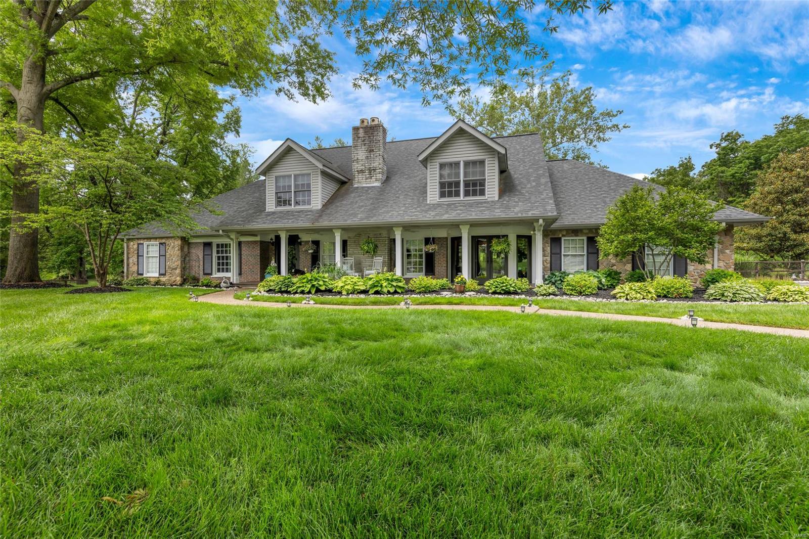 Nestled in an exclusive culdesac, this picturesque 4 bedroom, 4.5 bathroom residence exudes elegance around every turn. Rich wood floors in the foyer lead you to a refined living room. Formal dining features built-ins and doors leading to the inviting front porch. Gourmet kitchen boasts custom cabinetry, granite counters and SS appliances - ideal for culinary enthusiasts. Butlers pantry offers abundant storage, perfect for seamless entertaining. Vaulted family room, illuminated by skylights, includes a stone fireplace and adjoins the breakfast area. Retreat to the expansive primary suite, complete with luxury ensuite bath, ample closets and see through fireplace to the cozy study. Upstairs presents a bonus space, 3 spacious bedrooms, each with window seats and WI closets, and 2 full baths. The lower level includes a large rec area and full bath. Step outside, your private oasis awaits: stunning saltwater pool tucked beautifully on a lush acre lot - all in a prime West County location Additional Rooms: Mud Room