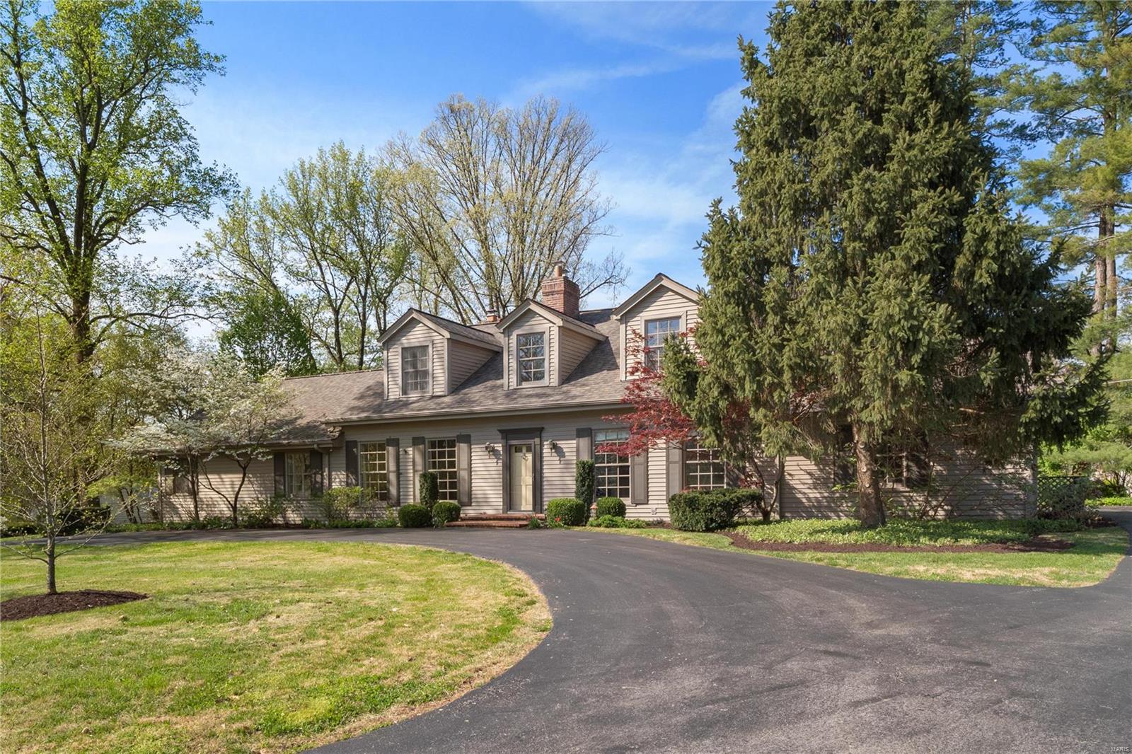Great home on quiet three home cul-de-sac street in convenient Ladue location. Original home was built in 1956. Current owners took the old house down to the foundation and rebuilt this house in 1998. The first floor features 9' ceilings. Spacious open kitchen to great great room features a large island, wet bar, and butlers pantry. Large catch-all mud room, laundry room and powder greet you when entering the house from the driveway or garage. A cozy secondary family room with wet bar, beamed ceiling, and brick floors overlook the back patio. First floor master suite with his and hers walk in closets. There is an office and additional full bath right next to the master suite. Master bathroom has a double vanity, steam shower, and separate tub. The two-story foyer takes you to a second floor loft area and three more bedrooms and two more bathrooms. Basement has finished recreation room area.