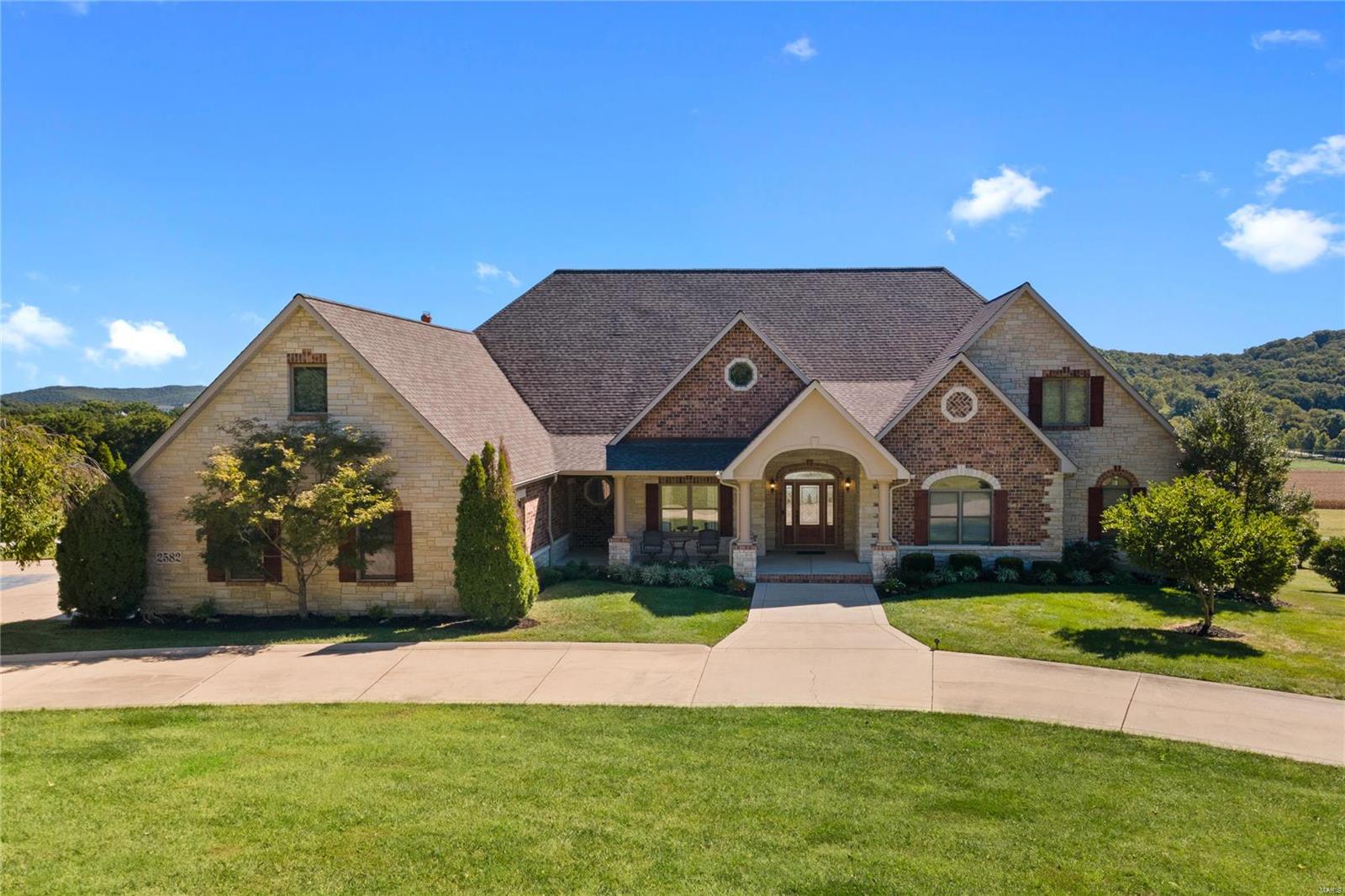 Incredible opportunity to own the home that has it all! This atrium ranch sits on four acres and offers five bedrooms , five full/two half baths AND a bonus upper level bedroom suite perfect for in-law suite, home office or teen room. The 2-story great room features a stunning gas fireplace and incredible views from the Palladian windows. The spacious chef’s kitchen offers a center island, 42-inch cabinets, stainless appliances, granite counters, walk-in pantry and opens to the charming hearth room. The master suite is an oasis w/ private deck and luxury bath with features a steam shower. The finished walk-out lower level features a spacious rec room with
wet bar, home gym and 2 BRs. Outside enjoy the inground pool after a hard day’s work. Multi-purpose structure measures 48x36 with five (12x12) stalls, tack room, ceiling fans, wash room, loft and exterior social area. This building has MANY uses. Additional features include security system, whole house sound system. Rockwood Schools! Additional Rooms: Mud Room