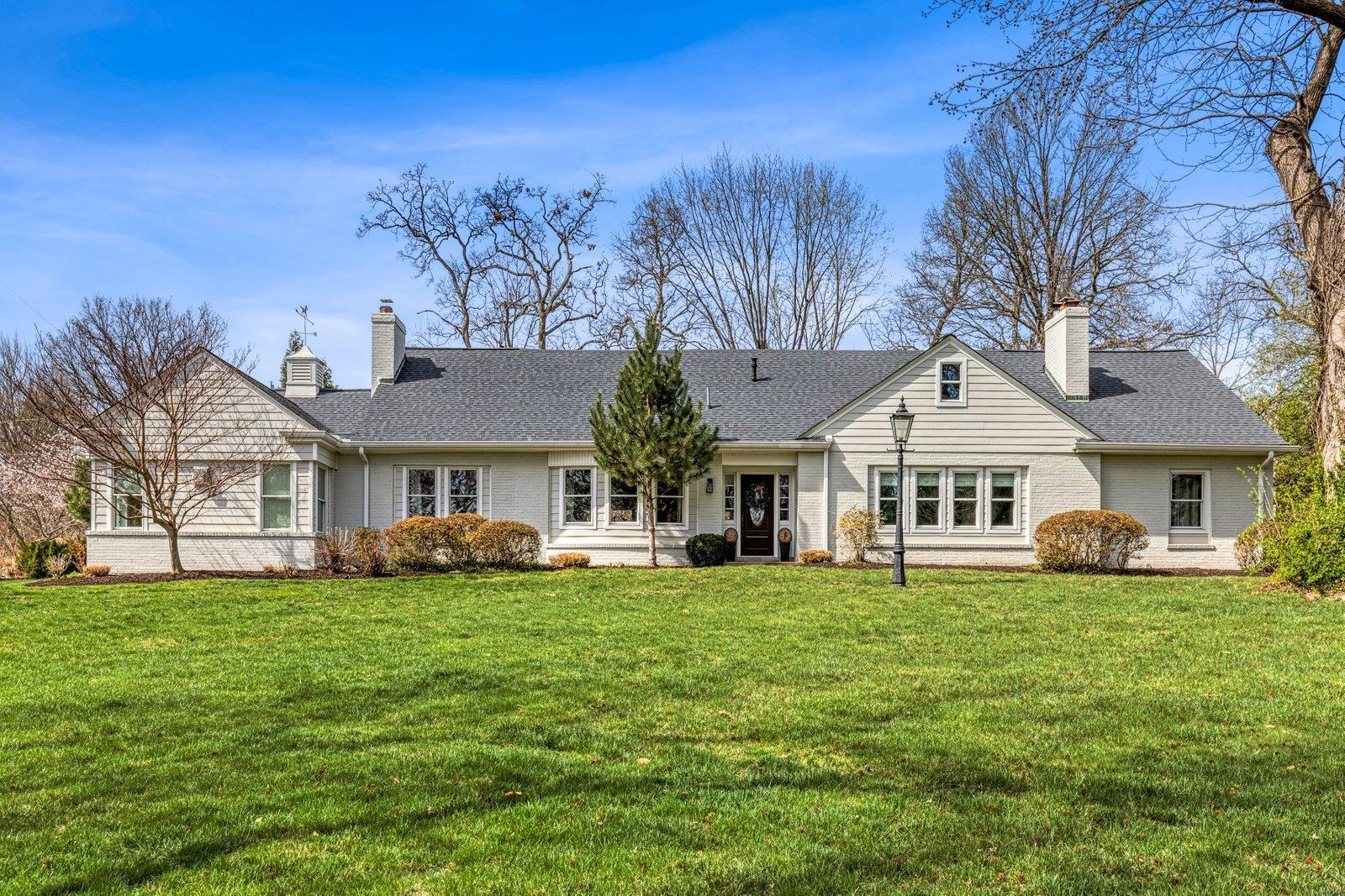 Welcome to this lovely home situated on a private one-acre lot. This spacious residence boasts 5 bedrooms, 4.5 baths, and 4 fireplaces. The main and upper levels each host a convenient laundry room, and the pantry and closets throughout feature custom shelving. The large chef's kitchen, with new double ovens and fridge, together with the adjacent dining room, form the heart of the home and are complemented by a charming hearth room with built-in bookcases. The main floor master suite offers a sitting room overlooking the beautiful yard and pool, his and hers closets, and master bath with steam shower and bubble tub. Ensuite bedrooms on both upper & lower levels provide flexible living arrangements, perfect for  a nanny or in-laws, and upper bedrooms each feature a sitting room/playroom. Enjoy the top-rated Ladue schools and the convenience of the location.  This home offers abundant space and updated amenities to suit your lifestyle. Loads of storage space in LL could be finished. Additional Rooms: Mud Room
