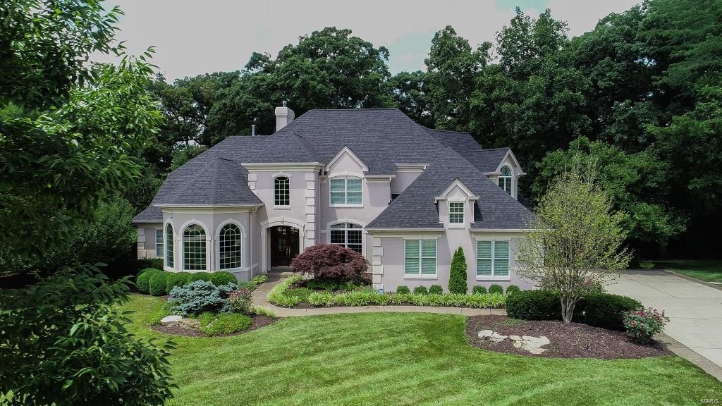Magnificent 1.5-Sty custom-built home situated on 1.12 acre, cul-de-sac lot, backing to Laumeier Sculpture Park in prestigious Sunset Ridge Subdivision w/5 Bd, 4.5 Bth & 7600 Sqft of living space. Main Floor features formal Dining Rm w/wainscoting & crown molding, vaulted Sitting Rm, Great Rm w/2-Sty curved wall of windows, FP, arched built-ins & Butler’s pantry, Kitchen w/custom cabinetry, granite counters, island/breakfast bar, SS appliances & W/I pantry, adjoining vaulted Sunroom, large Main Floor Laundry/Mudroom & Powder Rm. Main Floor Master w/2-tiered trey ceiling, private Sitting Rm/Office, dual W/I closets, luxury Bth w/double vanities, large W/I shower & jetted tub. Walk up front, or back stairs to find 3 large Bd (1 en suite & 2 share Jack & Jill Bth) all with W/I closets! W/O LL w/5th Bd, full Bth, Rec Rm, wet bar w/custom cabinetry including glass display case & center island bar, plus a full gym! Highlights: 3-car garage, sprinkler system, central vac & alarm system. Additional Rooms: Mud Room, Sun Room