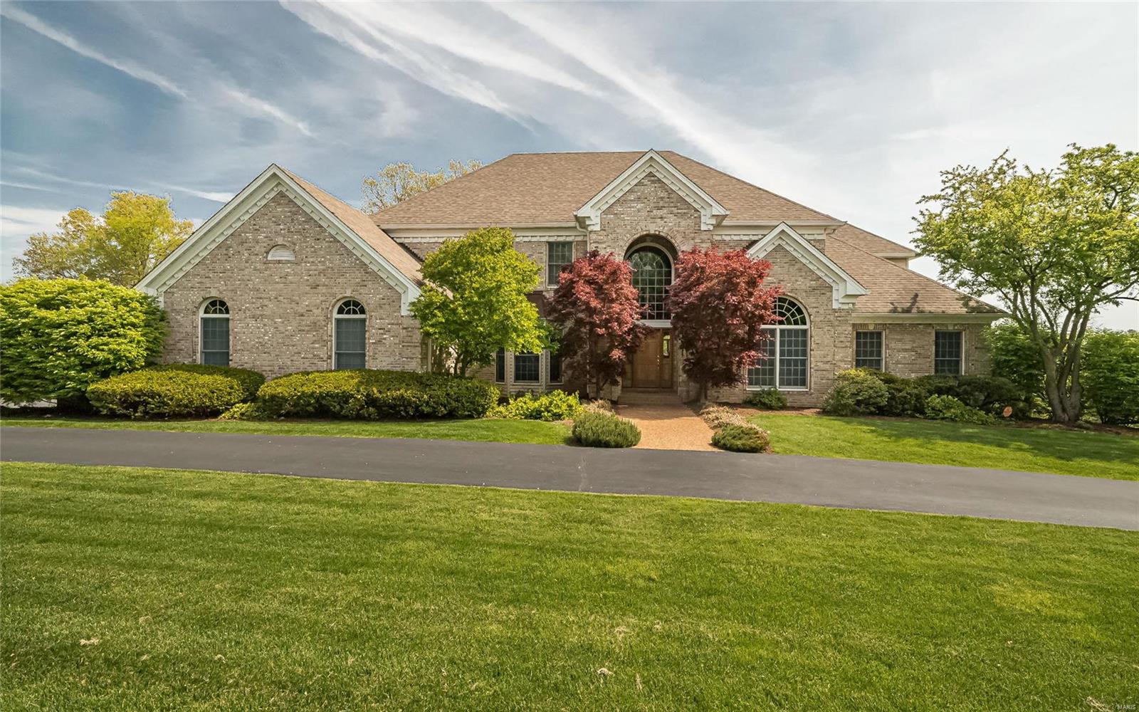 This rare estate offering is the quintessence of luxury and displays gracious living in prestigious Creve Coeur and the Ladue School District. The architecturally significant 1.5 story home features: breathtaking views of the 1.45 ac lot from all levels of the home, 4 bedrooms, 5 full & 2 (½) baths all on 5860 total sq ft, superb appointments throughout, 2 story entry (wood floors), grand curved staircase, expansive walls of windows (many arched) provide nearly every room with natural light, 2 story great room with hi volume custom brick fireplace, Chef’s kitchen (wood floors), custom cabinetry, 8’ island, Thermador,Viking & Bosch appliances, hearth room with brick fireplace, access to deck, 1st floor master suite-access to the executive study (wood floors)-stunning remodeled bath & his & her custom walk-in closets, 3 additional large ensuite bedrms, finished W/O LL with rec rm, wet bar & full bath, separate exercise room. Circle driveway allows entry from Mosley Rd or Mosley Hill Dr