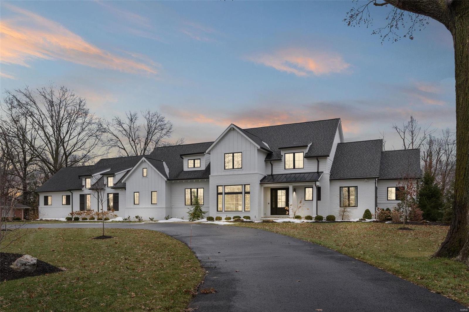 This beautiful Frontenac custom home welcomes you w/detailed millwork, hardwood flrs & 10' ceilings on the main flr. The large living rm features a wood beamed ceiling & fireplace. The gracious dining rm is filled w/light & charm & the private office features attractive bookshelves. The gourmet kitchen includes custom cabinetry, Thermador appliances, Carrara marble countertops, walk-in pantry, breakfast rm, a bar w/ ice maker & beverage refrigerator. The adjoining hearth rm has 14' vaulted/beamed ceilings & 2nd fireplace. The main flr laundry/mud rm is HUGE & has additional closets for more storage. The primary suite offers "his" & "her" custom closets, a grand bath w/shiplap paneling, Carrara flrs, & separate shower & tub. Upstairs there are 3 ensuite bedrooms & 2nd floor laundry. The LL is ready to be finished & has an egress window. Designer lighting throughout, 2 main fl half baths, 4 car garage, large level yard & lot. This home is truly impressive & awaiting your special touches!
