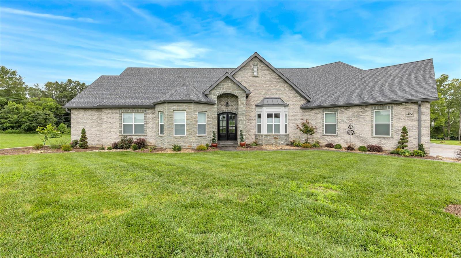 Located near three golf courses w/ wildlife, this home offers the best of both worlds—secluded country living & convenient access to nearby amenities. Enjoy this newly built beautiful ranch home featuring 4 beds, 5 baths & over 4,000 sqft of living space nestled on over 3 acres of picturesque land! This home was designed w/ accessibility in mind, featuring a handicap accessible en suite. Whether you're hosting lively gatherings or seeking tranquility the beautiful pool w/ water & fire features offers the perfect oasis! This home embraces modern luxury while honoring the charm of a classic ranch. Beautiful floors & Gorgeous Lighting throughout the home, neutral paint, S/S appliances, 2 Dishwashers & Dual Ovens, Quartz Counters, 2 Gas Fireplaces, Custom Shades, 10ft Ceilings, 8ft Doors, Gorgeous Stamped Concrete, Putting Green, Practice Green, sand traps & MORE! Don't miss your chance to own this exquisite luxury ranch home, where accessibility, beauty, & entertainment merge seamlessly!