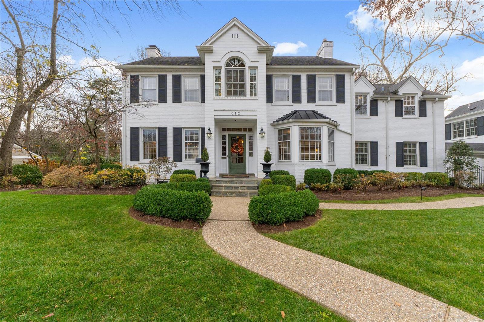 Elegant colonial home with 5 beds/4full & 2 half baths. Exquisite formal living rm & dining rm w/built-in bookshelves and fireplace. The kitchen has custom cabinetry, solid surfaces, high-end appliances, pot filler, huge island and breakfast area. The amazing family rm offers coffered ceiling, fireplace, built in bookshelves, and access to back patio and screened in hearth rm. A main fl guest suite w/ full ba and laundry. Upstairs you will find a luxurious master suite & bath w/dbl vanities, steam shower, tub, large closets, and a sitting room to decompress after a long day.  There are 3 additional beds, 3 full baths, & 2nd floor laundry. The LL rec space is great for informal entertaining. Family room w fireplace, billiard room, kitchenet, full ba and an outstanding wine cellar. Surprise! A full entertaining space above the garage w/ kitchenet, full ba, lots of storage . Magnificent back yard w/a covered porch, hot tub. In addition the home has  3 car garage, & extensive landscaping. Additional Rooms: Wine Cellar