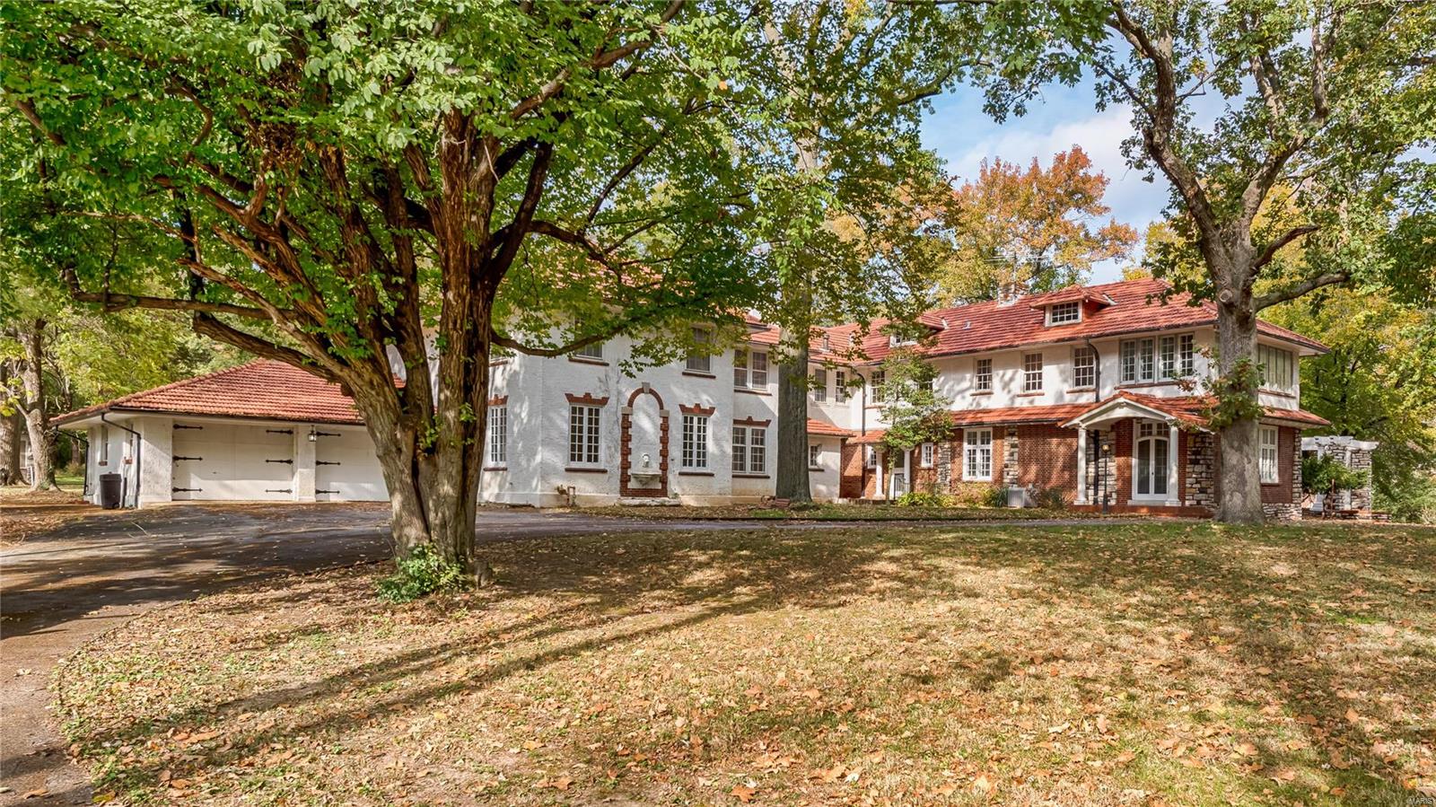 The Watkins Estate is perhaps one of Ladue’s grandest properties. Located on over 3 acres is this impeccable 1926 Spanish Revival style mansion. The architectural details have been preserved & enriched with age. It's your turn to be the next caretaker of this grande dame and start the music again! This home is being sold As-Is. Additional Rooms: Mud Room