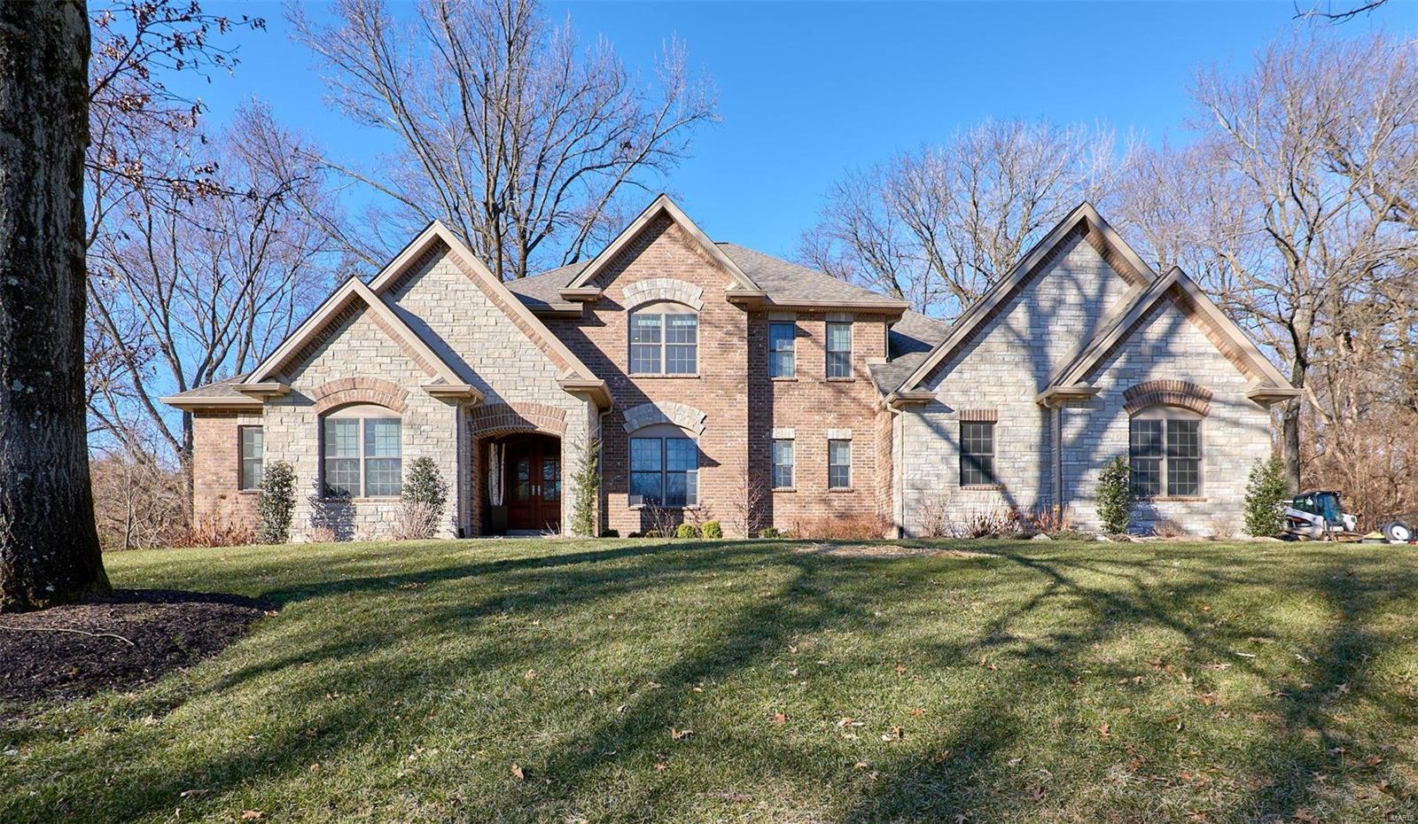 Gorgeous custom built luxury home on a one acre lot in the sought-after River Bend Estates.  This home has high-end finishes throughout.  The chef’s kitchen has custom cabinetry, a 10 foot island, and looks into the window lined hearth room with stone fireplace.  Large living room and separate dining room.  Retreat to the main floor master with two walk-in closets and a spa like bathroom.  Each of the 3 upper level bedrooms have their own bathroom and there is a loft area!   The lower level has another bedroom, full bath and 1500 sq ft of finished area, great for the kids to hang out, family movies, game nights and hobbies.  The neighborhood has a community pool to join or install your own pool in the private, tree lined, park-like level back yard.  The surrounding homes are on 1+ acre lots, many of them newer custom homes.  Conveniently located near 141, 40/64, and 270.  Come see this one! Additional Rooms: Mud Room