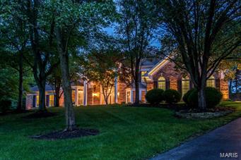 Spectacular DeShetler-built 1.5 Sty w/7612 sq ft of total living space in premier neighborhood! Grand 2-sty hardwood foyer highlighted by dramatic sweeping staircase leads to handsome paneled library w/sculpted ceiling & built-in bookcases, elegant dining room w/ beautiful millwork & bay window & stunning great room w/2-sty wall of windows, brick fireplace & atrium door to patio. Spacious open kitchen w/42” cabinetry, premium appliances, center island w/breakfast bar & wet bar adjoins breakfast room  w/convenient planning center & vaulted hearth room w/full-height brick fireplace. Coffered master bedroom suite w/huge walk-in closet & luxury bath w/Jacuzzi. The 2nd floor extends the living quarters w/4 additional bedrooms, 2 w/private baths & 2 w/Jack n’ Jill bath. Incredible walk-out Lower Level w/recreation room w/marble fireplace & wet bar, family room, game room, media room & full bath. Tree-lined 1.3 ac grounds include patio w/grill center, pool, hot tub & 4-car garage.