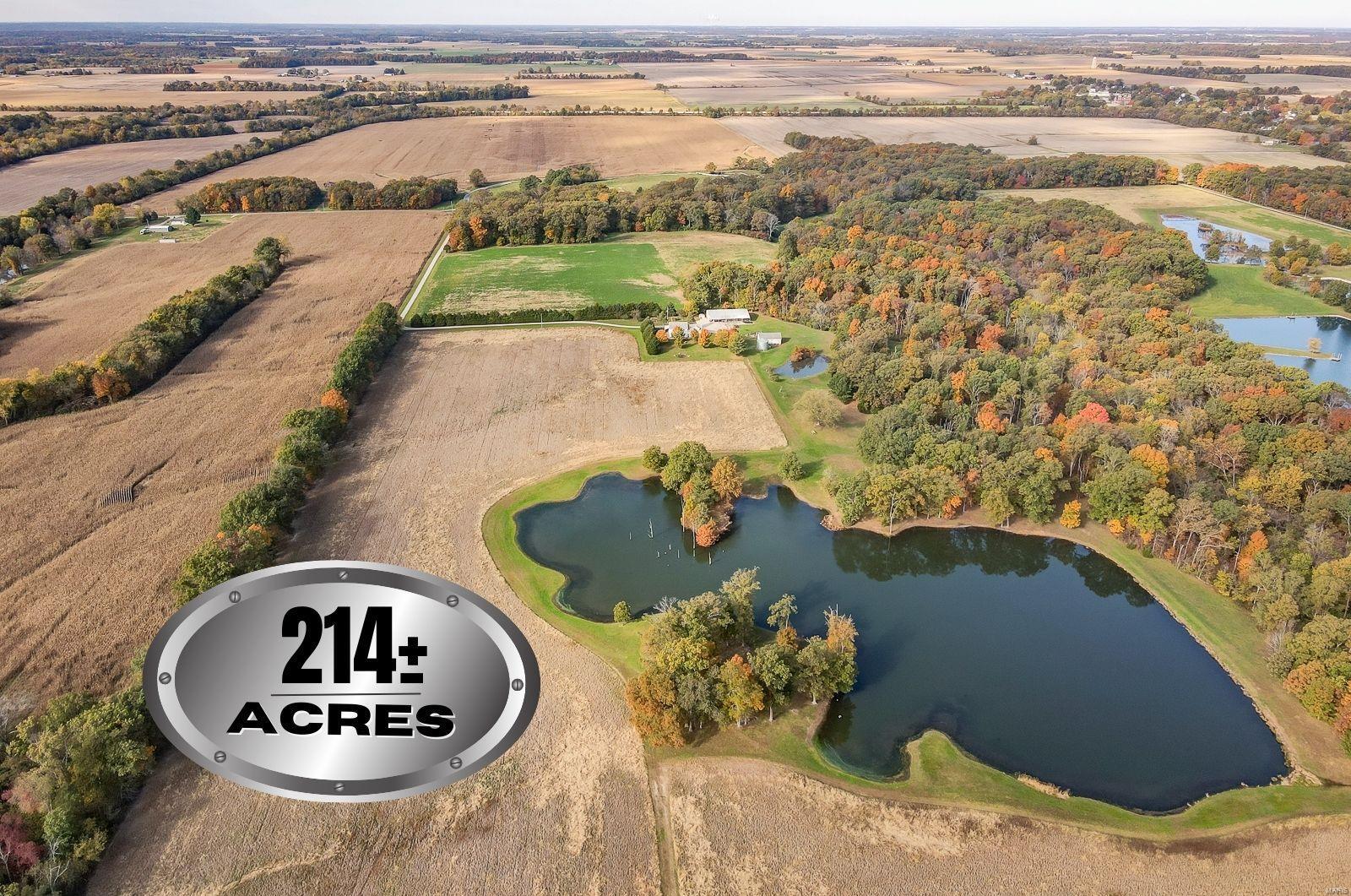 214 +/- acres near Dubois, IL. - Tillable acreage, hunting  ground, lake & homestead. Approximately 75  tillable acres with open farming rights for 2022. The lake is over 5  acres and runs from shallow to deep with a dam that is mowed. The  balance of  land is prime hunting - many family members would be able to deer hunt this sprawling farm at the same time. In addition, the topography of the  land varies just enough to  enjoy ATV or motorcycle trails or a shooting range could be set up.   Homestead consists of a 4 bed 3 bath house that was built in the mid  1990's and a 36' X 80' pole shed with 15' lean-to. Shed has a full  concrete  floor.  Abundant white tail deer and wild  turkeys have been seen on the property and if bird watching is your  hobby - there have been sightings of bald eagles and hummingbirds are  also frequent visitors. Must be accompanied by an agent and an appointment is required to view. There is nothing to see from the road without being on the private drive.