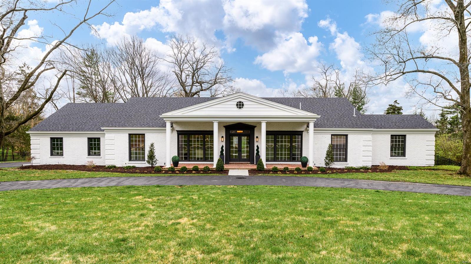 Nestled within the esteemed Steeplechase neighborhood, this meticulously-renovated 4-bedroom, 4.5-bathroom ranch home sits on an enchanting acre lot. Stripped to the studs and replaced with modern elegance, the sun-soaked living spaces flow seamlessly throughout. The living room w/ stone-surround fireplace opens to the gourmet kitchen adorned with copious cabinetry and counter space that will be the envy of all your friends when you host the biggest dinner parties in your massive dining room! The primary bedroom suite is a sanctuary, featuring a luxurious bath with wet room and large walk-in closet. Two additional bedrooms and baths complete the main. Lower level offers a sprawling recreation area with wet bar, fourth bedroom, and full bathroom. Entertain all summer on your patio overlooking the large fenced yard and private, in-ground pool. New roof, oversized two-car garage, two main-floor W/D hookups, and more. Ladue school district and close to everything. Welcome home. Additional Rooms: Mud Room
