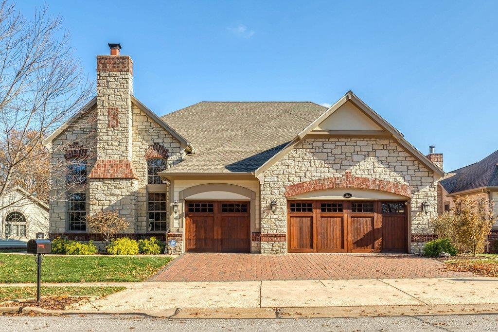 This spectacular freestanding 1.5-sty villa features well-appointed amenities & extensive renovations both inside & out including custom-designed kitchen & baths, newer carpeting & doors, 3-season deck & upgraded systems. Impressive foyer opens to formal living room with cast stone fireplace & coffered dining room with adjacent wine cellar. Barrel-vaulted entryway leads to stunning great room with marble fireplace flanked by built-in bookcases. Chef’s kitchen with 42” white cabinetry, marble countertops & 7’ center island adjoins breakfast room with butler’s pantry & atrium door to sunroom. Spacious master bedroom suite offers an appealing retreat with wide bay window & luxury bath with shower spa. The 2nd floor extends the living quarters with 2 additional ensuite bedrooms & loft sitting area. Lower Level includes recreation room with entertainment center & wet bar, game room, guest suite & 1/2 bath. Situated on a premium lot overlooking the pond & 5th green with deck & covered patio. Additional Rooms: Sun Room Location: Detached, End Unit, Ground Level