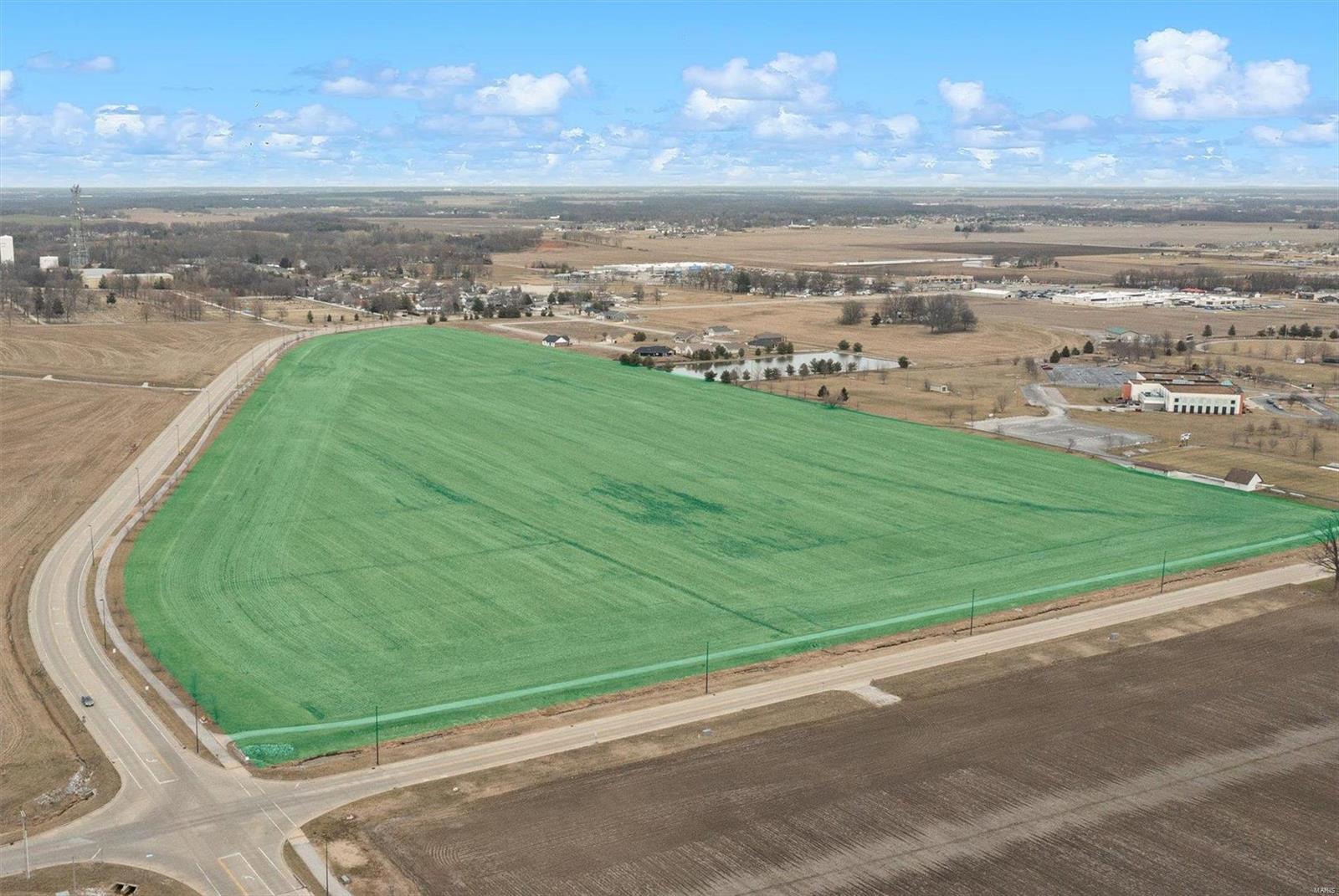 RARE OPPORTUNITY with development potential!  47.41 acres located in close proximity to downtown Highland. Access to all utilities including water, sewer, and electric.  Currently operated under a cash rent agreement. Well suited for investor or developer.  Currently Zoned "R1-C Single Family Residential".