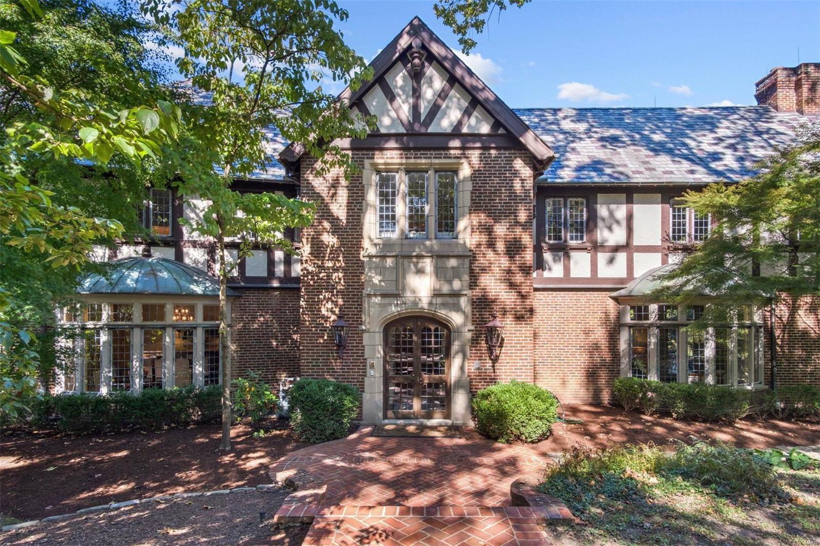 Located in one of the most prestigious neighborhoods in Ladue, this 7500 square foot home designed by noted architect Gale Henderson is situated on 2.85 beautiful private acres, seamlessly blending the exquisite architectural details and formal entertaining spaces which are hallmarks of homes of this era with the modern amenities and more cozy living spaces sought by today's families. There is an elevator that goes from the 4 car garage to the second floor. The inground pool and Boxwood gardens are stunning. The separate, well-appointed pool house with additional space for entertaining, a full kitchen, bedroom and 2 full baths could easily serve as private guest quarters. Wonderful outdoor terraces provide ideal spaces for entertaining. Fantastic lower level features a family room with fireplace, rec room with large bar, exercise room, full steam bathroom & large wine cellar. Expansive third floor offers an abundance of storage areas. This is an exceptional offering not to be missed. Additional Rooms: Wine Cellar
