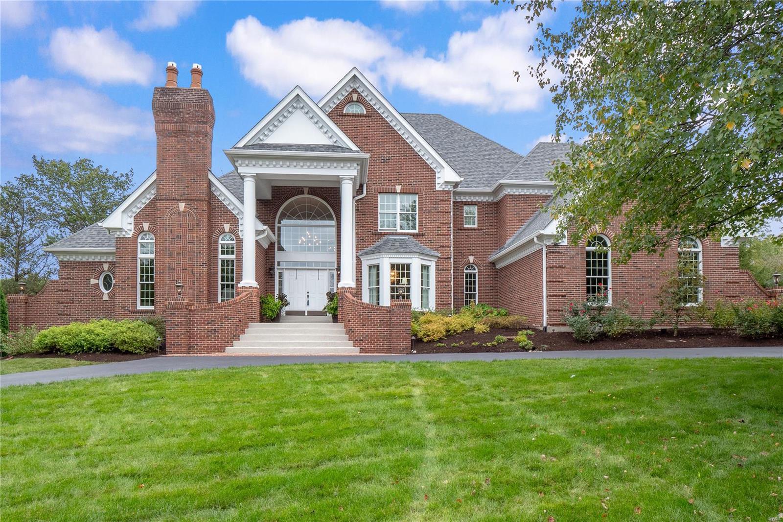This Beautifully designed 1.5 Story Estate home built by Deshetler is an exceptional blend of classic details, chic finishes & an incredibly functional floorplan on a 1 acre cul-de-sac with more than 7500 sqft of finished space for your living enjoyment. Two-sty marble foyer leads to paneled Library with bookcases & brick fireplace, Dining room, impressive Great Room with wet bar & marble fireplace flanked by palladian windows. Chef’s Kitchen with 43” cabinets, granite counters, commercial grade appliances, butler’s pantry, Breakfast Room & charming Hearth Room with vaulted ceiling & stone fireplace.  Master Suite with bay window, sitting area & lavish bath with shower spa. Front & rear staircases access three additional bedrooms, 2 Baths plus bonus loft area.  LL includes a large recreation room with fireplace, wet bar, game room, office & full bath. Resort style pool surrounded by lush gardens, patio with grilling station & stone fireplace. Three car garage. Exclude: Great Room TV
