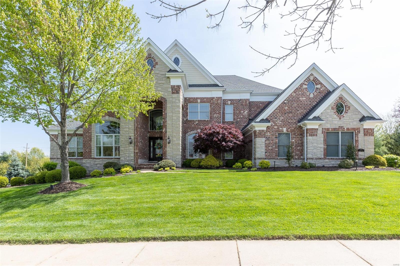Welcome home to Savonne Ct! Perfectly located on picturesque private 1 acre lot in the heart of Chesterfield Valley. Close to 7000sq ft of TLA! In sought-after Miramonte subdivision, the brick/stone ext, 24 ft ceilings & flood of natural light welcome you. Beautiful limestone flooring ushers you to the 2 stry GR. Kitchen is perfect for the inspired home chef with plenty of 42” cabinets, walk-in pantry & uniquely shaped breakfast rm surrounded by windows. The expansive hearth rm provides add'l living space. ML master boasts trey ceilings, his/her WI closets & bonus sitting rm w/ countless uses! This leads to the ML study w/ lg windows.  Elegant curved front staircase has sweeping views of GR below & park-like backyard. 2nd floor adds 3 BRs - each w/ ensuite bath. Walkout LL is an entertainer’s dream w/ huge bar, media rm, game rm, see-thru gas fireplace, 5th BR and full bath. Lg comp deck allows shaded outdr living space overlooking pool. Comfort & convenience mark this great estate!