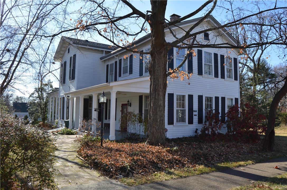 Located one block from downtown Kirkwood on the southeast corner of Jefferson and Fillmore this stately home sits on .34 acre, 215'x150' lot with park like side yards. 2 story home w/wrap around front porch, side porch, 4100+ sq. ft, 5 Bedrooms, 3.5 baths, full basement w/detached carriage house garage. Awe inspiring Grandeur expressed throughout this beautifully designed 1850's elegant home. Great rm 24'x18', Dining 19'x14', Wood burning fireplace, oak wood floors, 12' main ceilings, 10' 2nd flr ceilings, 11" baseboards, some 8' interior doors, pocket doors,  7' windows, curved free standing spiral staircase, curved upper hallway, rear service stairs, claw foot tubs, working embossed scroll curved radiator(s), crystal chandeliers. 1 yr roof, metal siding, 2-Carrier Ac units, 1 Carrier HVAC, 1-Boiler, 2-50 Gallon Water, new sewer lateral, fireplace liner. 306 East Jefferson is a Kirkwood Historical Landmark maintained with utmost care and excellence.