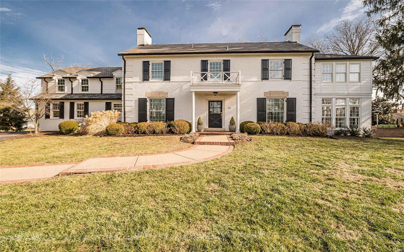 Gleaming wood floors, handcrafted moldings & arched entryways define the charm & character of this 2-sty Georgian Colonial! Impressive hardwood foyer leads to formal dining room & living room with marble see-through fireplace, built-in bookcases & 2 sets of French doors that open to light-filled sunroom with brick fireplace & atrium door to terrace. Designer kitchen with 42” white cabinetry, granite countertops, stainless steel appliances & butler’s pantry adjoins breakfast room with wide bow window & center island & family room. Master bedroom suite combines the enjoyment of a marble fireplace flanked by bookcases with luxury bath with shower spa & jetted tub & adjacent office. 3 Additional ensuite bedrooms & sitting room complete the 2nd floor living quarters. Walk-out Lower Level includes media room with fireplace & Murphy bed & full bath. Situated on an extensively landscaped .92-ac lot with patio, terrace with outdoor fireplace & 3-car garage. Award-winning Ladue School district. Additional Rooms: Sun Room