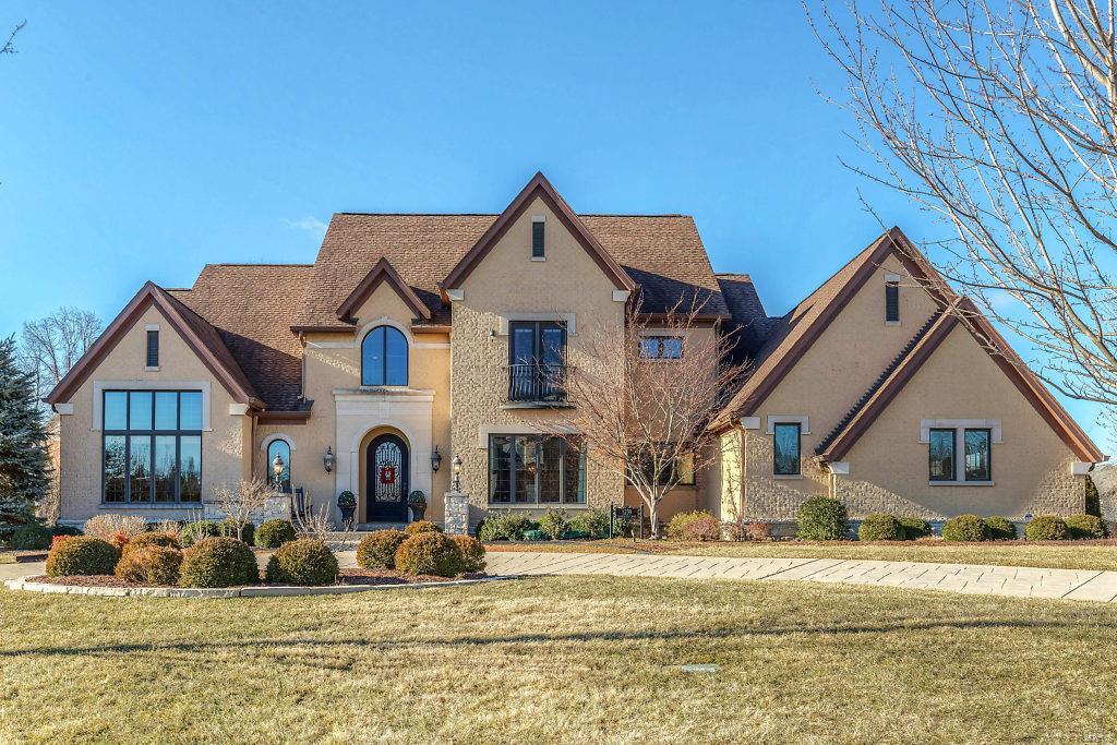 This beautifully designed 1.5 Sty Estate home features over 7800 sf of living space enhanced by soaring windows, eucalyptus hardwoods & elaborate moldings. 2-Sty marble foyer with dramatic curved staircase leads to vaulted study with built-in bookcases, elegant dining room & spectacular great room with wet bar & cast stone fireplace. State-of-the-art kitchen with quartz countertops, 42” gray cabinetry, commercial grade appliances & butler’s pantry adjoins light-filled breakfast room & hearth room highlighted by floor-to-ceiling stone fireplace. Sumptuous master bedroom suite with lavish bath with jetted tub & shower spa offers a relaxing retreat. Elevator access to 2nd floor living quarters with 3 additional bedroom suites, bonus room & 2nd laundry & Lower Level entertainment space with recreation room with fireplace & wet bar, game room, wine cellar, 5th bedroom suite & ½ bath. Grounds include outdoor living room with stone fireplace & grilling station, hot tub & pool with waterfall.
