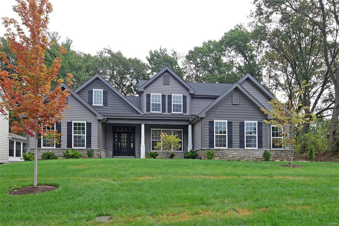 New Price! New construction by Freeman Homes now available in the highly sought after subdivision of Harwood Hills. This 1.5 story home boasts fresh, neutral décor, chefs kitchen and a main floor master suite. Lots of living space on the main floor featuring a main floor office, great room, dining room plus kitchen and hearth room. Hardwood floors on most of main floor. Upstairs you will find 3 spacious bedrooms (Jack and Jill bath plus en suite) Finished lower level with spacious rec room, half bath and plenty of storage. Three car side entry garage, great curb appeal, in-ground sprinkler system, private backyard with patio, fresh landscaping! Fabulous Kirkwood schools and located close to everything!