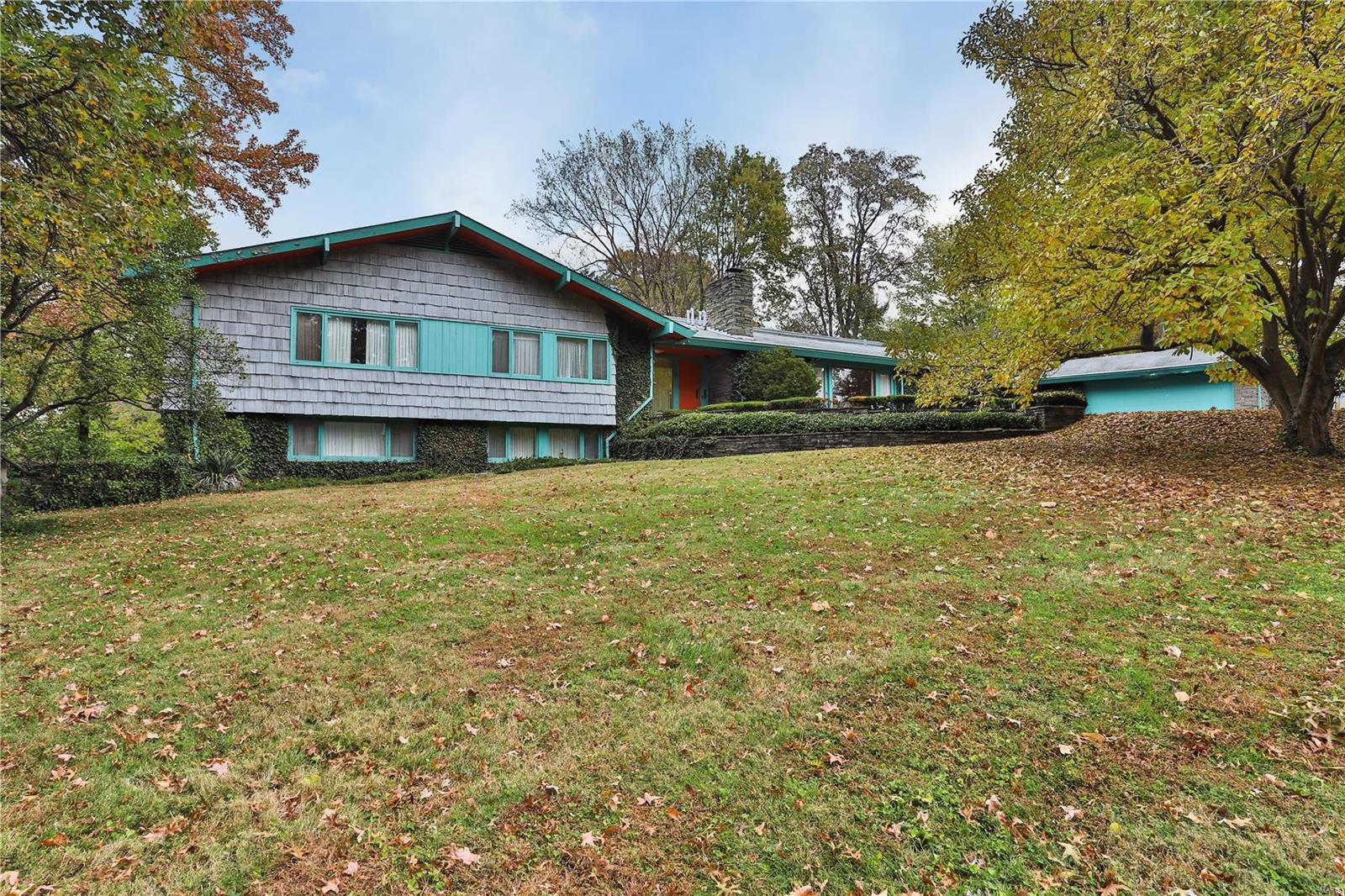 **BACK ON MARKET NO FAULT OF SELLER** Ralph Fournier Mid Century home situated on a fabulous lot, over an acre which is rare to find in Glendale. Prime location, property could serve as an ideal building site or choose to update and renovate. The hallmark of this home  are the spacious windows that look out from every room. Stone fireplace can be seen from the breakfast room & dining room. Vaulted ceilings, open floor plan, skylights, main floor laundry. Main floor master along with three other bedrooms. There are two bedrooms, den and family located on the lower level. Screen porch is 29 x 17 great space to relax or entertain, vaulted ceiling and fireplace. Large patio space, there is a shuffleboard area, tennis courts that need renovating. Plenty of space for a pool, sport court.  Attached garage with work room and storage room. Many options for this unique property. Property to be sold in as-is condition