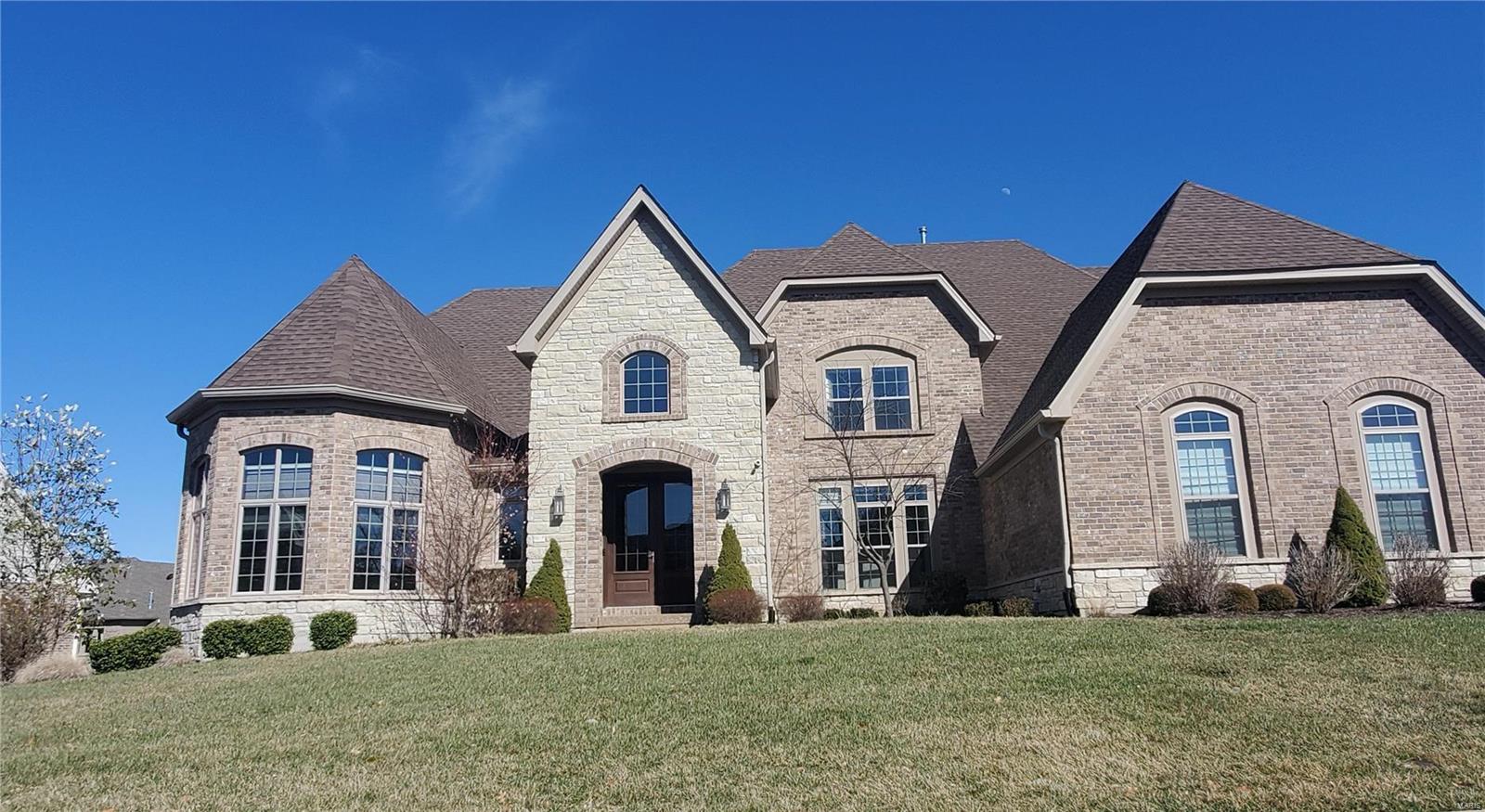 This lavish home is full of love and positive energy from its owners. This former display located inside gated community is loaded with upscale features. The meticulously selected high-end materials along with design and architectural features make this home truly unique. Overflowing with natural light 2-Sty limestone foyer leads from the Great Rm with wall of windows, hearth with gas FP to exquisite kitchen/brkfst area and open staircase. Main floor master suite is fit for a King and Queen with coffered ceiling,master bth and"Celebrity"size custom closet. 2nd floor has 3 bds, 3 full bths and bonus loft room. Finished basement with granite bar, guest bd and bth, open area. Find everything you need for your active and healthy lifestyle within your property: from a professional gym, sauna, steam room, hot tub to heated swimming pool and even a mini hockey rink! Special features include Sonos zoned sound system, remote control e-curtains and private back yard. Come experience luxury!