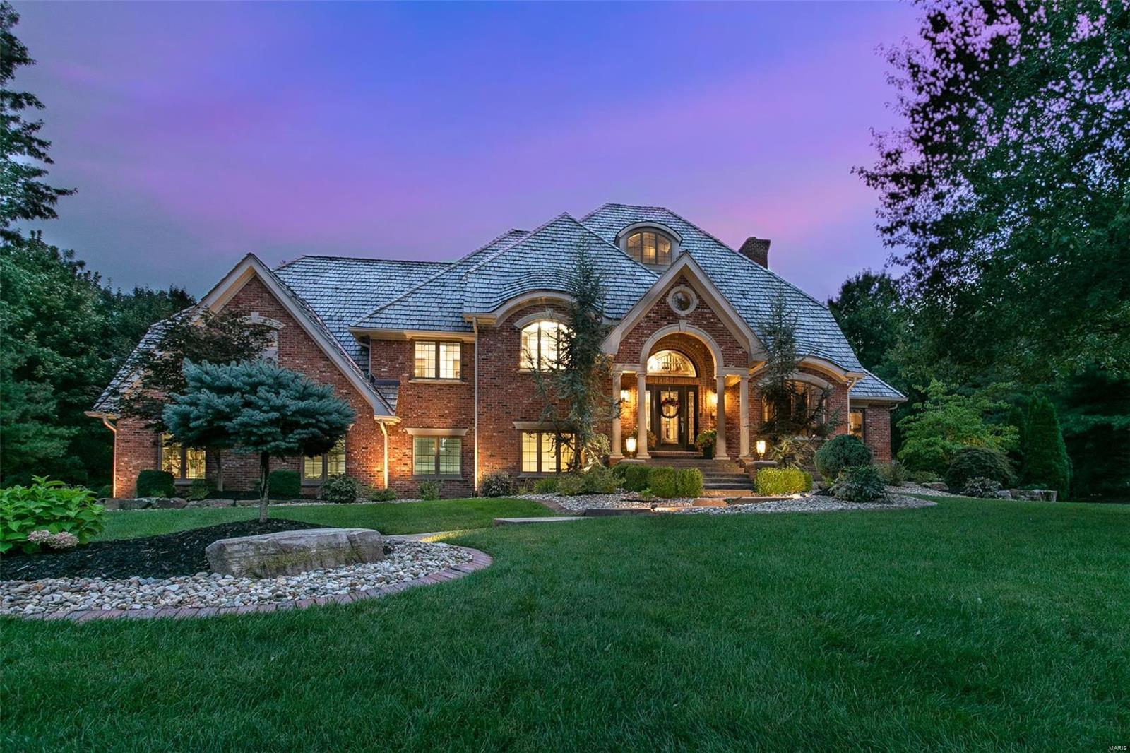 THIS is where luxury lives…… Exceptional features throughout are reflected between craftsmanship and creative design.  Experience luxury living in over 7,000 sq. ft. Private outdoor oasis focuses on saltwater pool surrounded by multiple fountains, gas fire features and seating areas.  Exquisite Primary bedroom suite to delight owners of this fine home. Premier kitchen to please the resident chef with breakfast areas and hearth room. Outdoor room overlooks tree lined beautifully manicured lawn. Lower levels feature additional kitchen, deluxe bar, guest suite, family room, plus so much more. This one of kind home will truly surpass your expectations. Schedule a private showing today. COOL: 14 SEER+